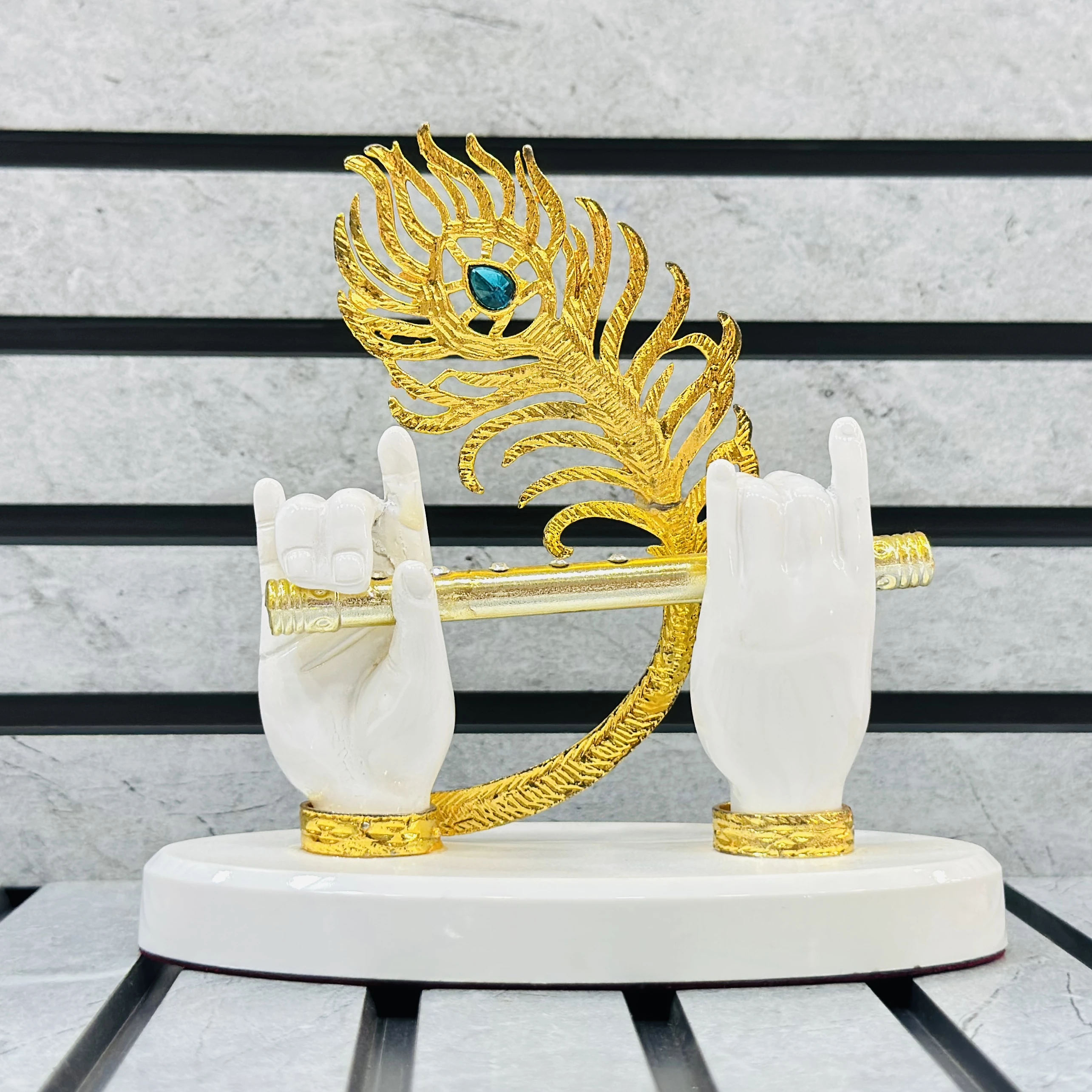 Gold gold-plated Lord Krishna hands with flute and peacock feather figurine.