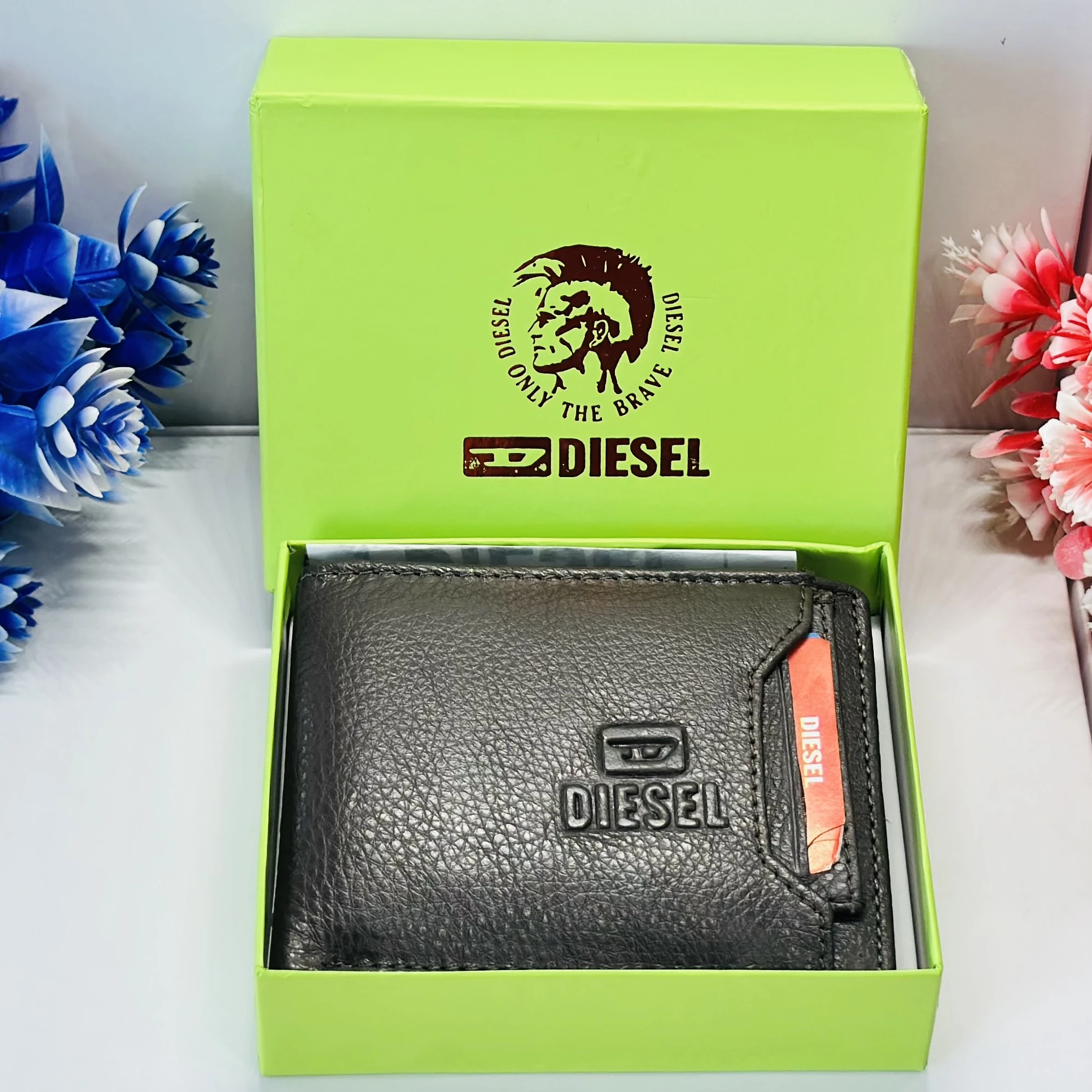 Diesel bi-fold wallet in black grainy leather.