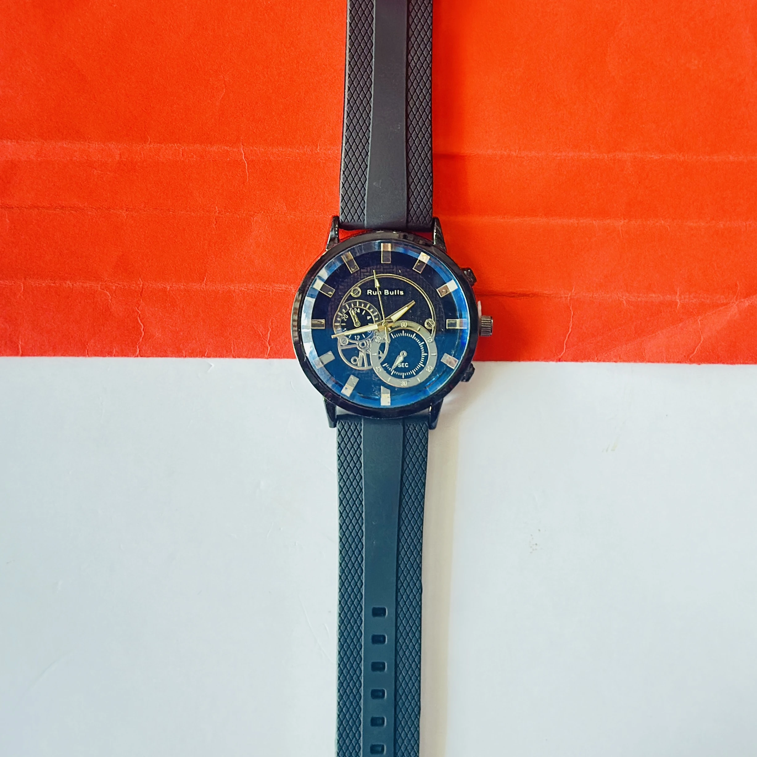 watch features a "Run Bulls" branded blue dial with a black silicone strap.