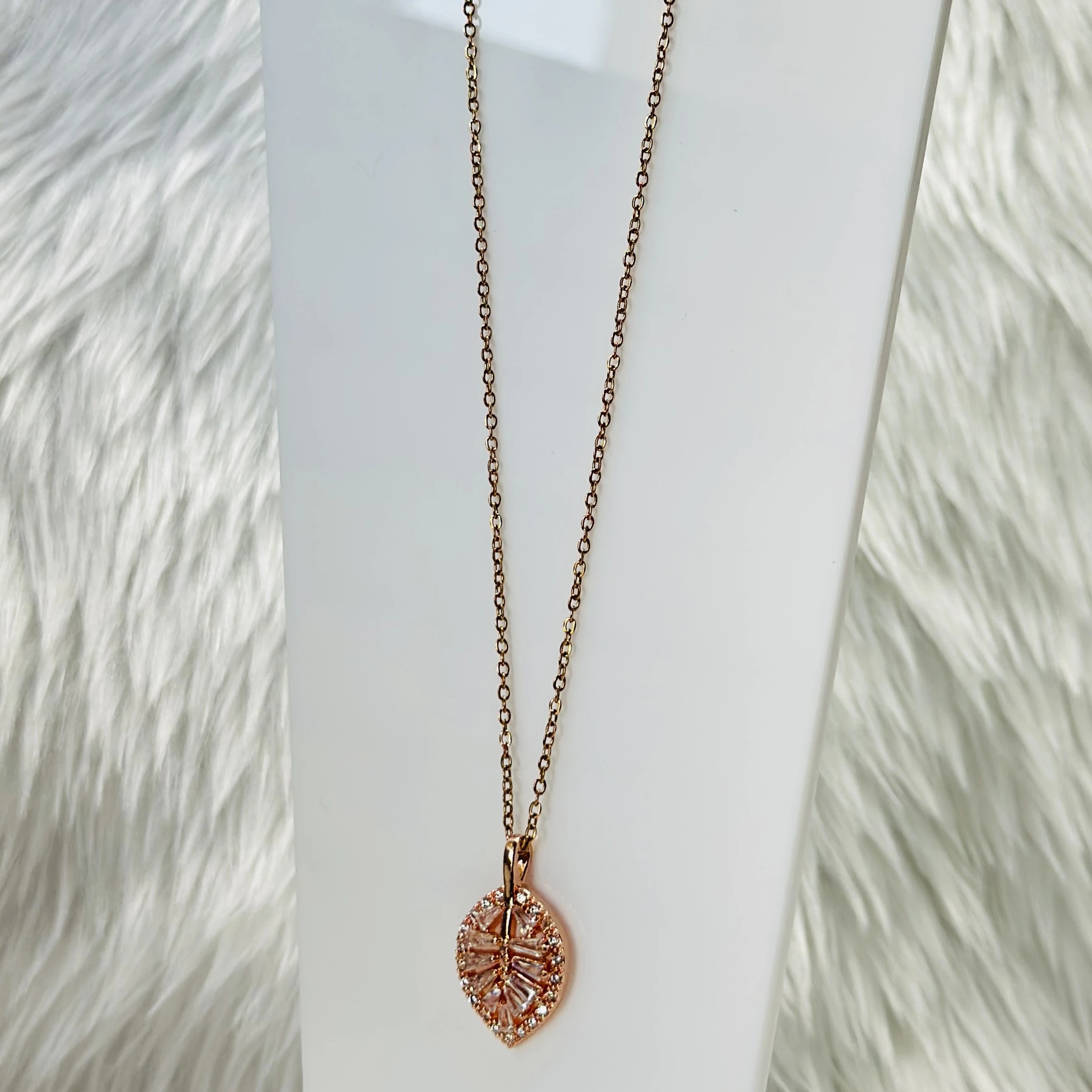 Rose gold palm leaf necklace with diamond accents, crafted from stainless steel.