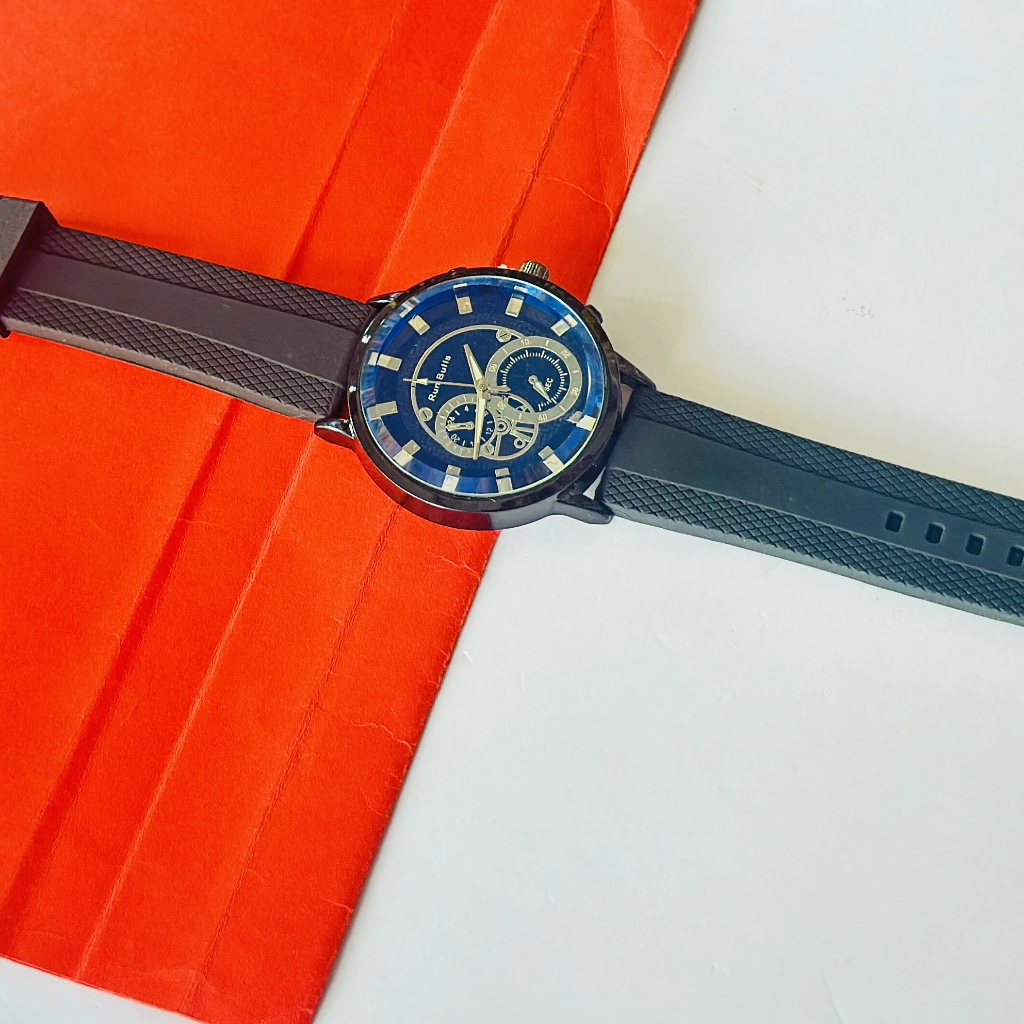 watch features a "Run Bulls" branded blue dial with a black silicone strap.