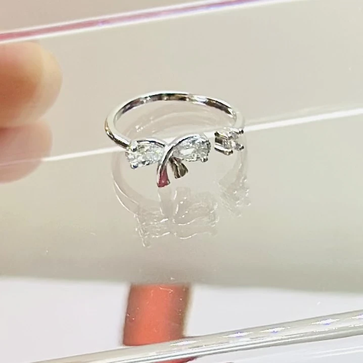 silver mini bow tie adjustable ring for women.