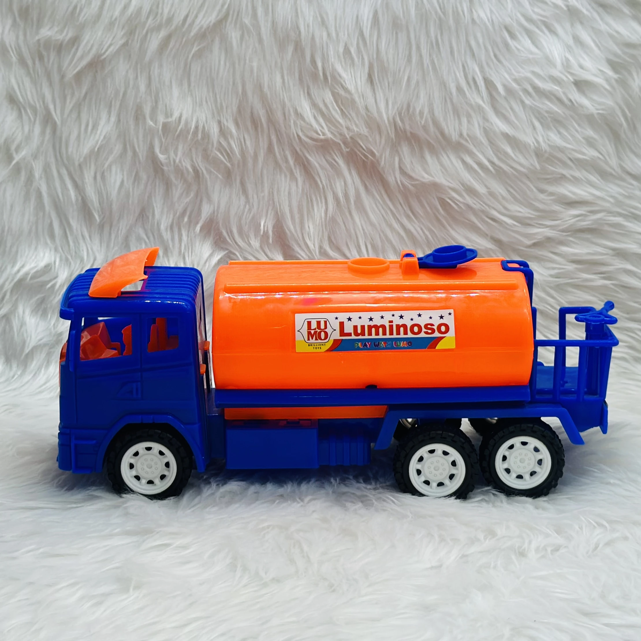 Luminoso brand friction-powered oil tanker truck toy.
