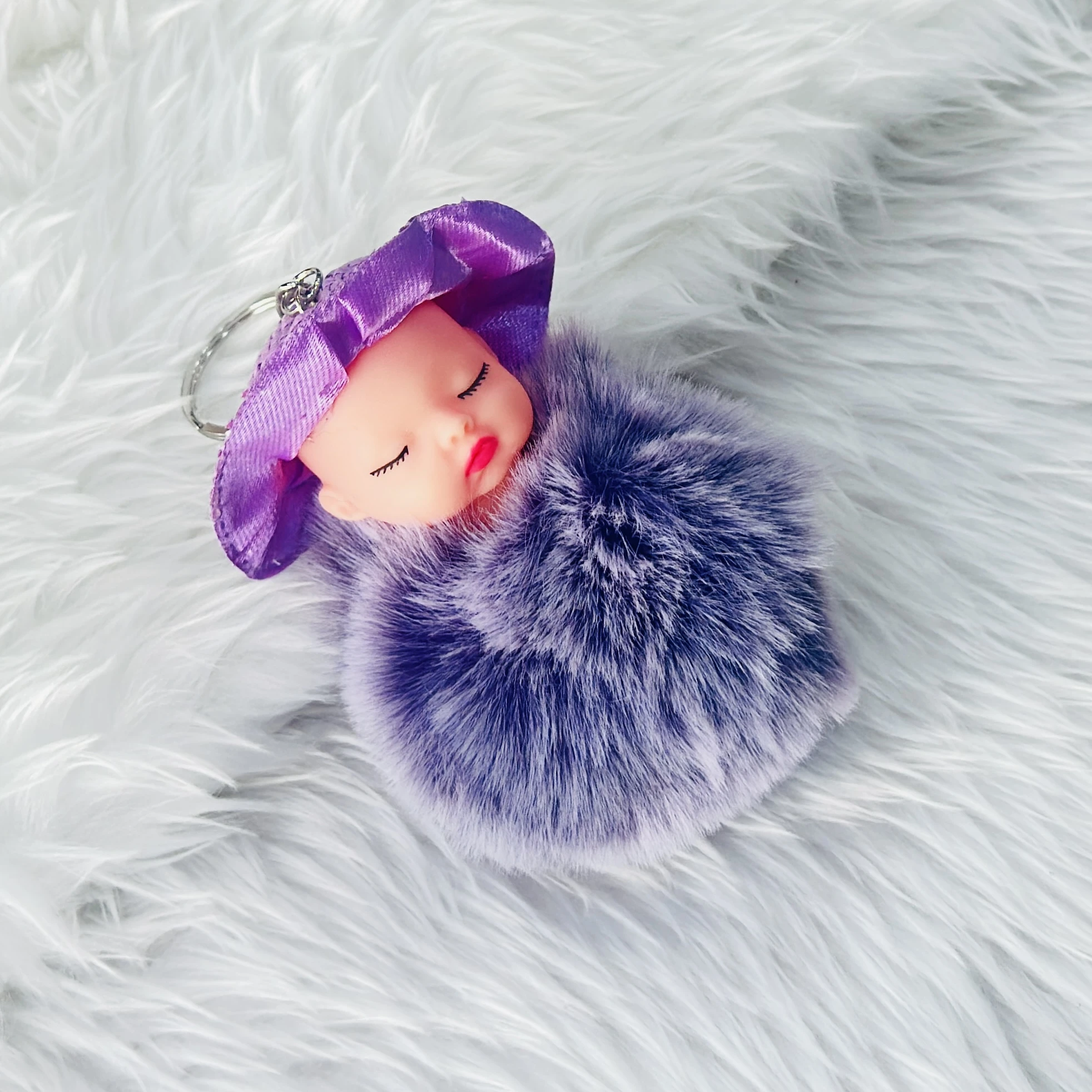 sleeping baby doll fluffy pom pom keychain