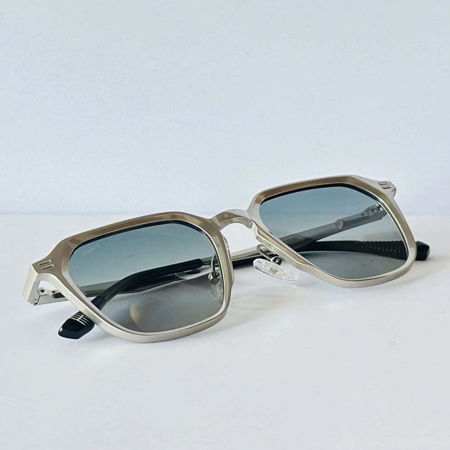 RAV-7 sunglasses feature a sleek black full-rim rectangle frame