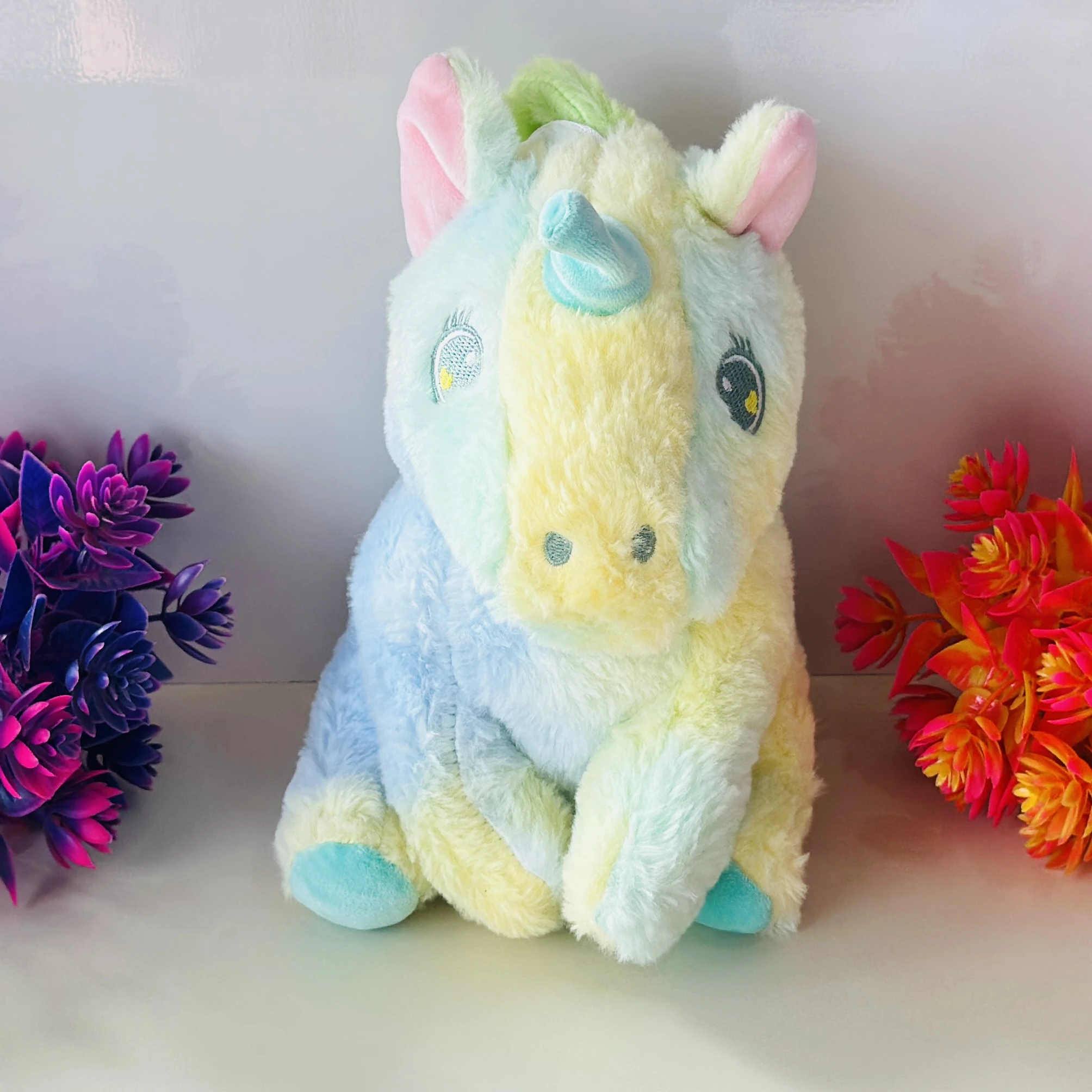 pastel rainbow-colored unicorn soft toy