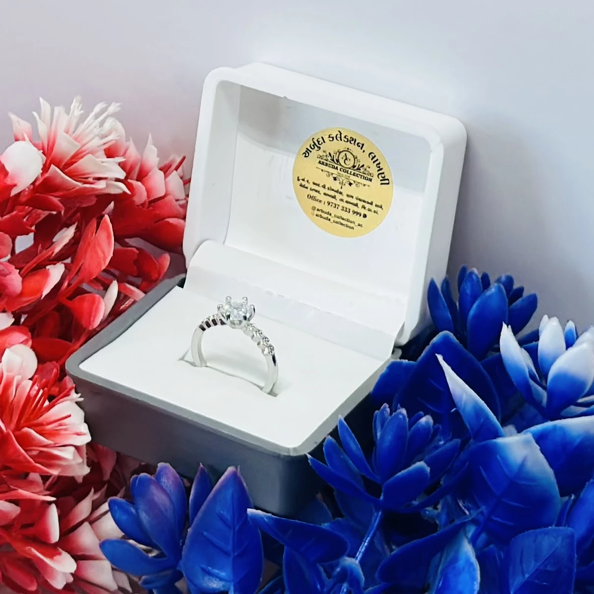 Silver ring with cubic zirconia stones.