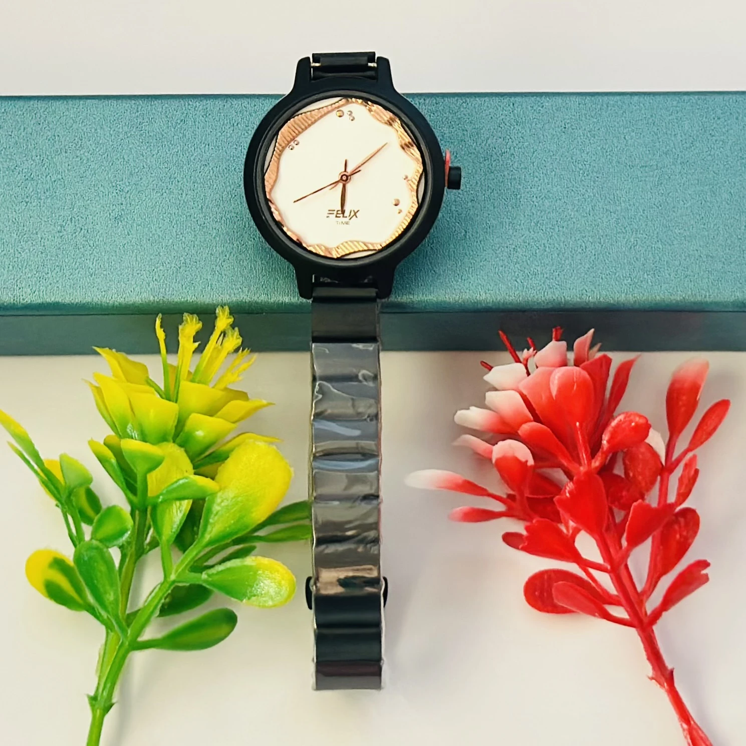 Felix Time analog watch for girls with a fancy metal strap.