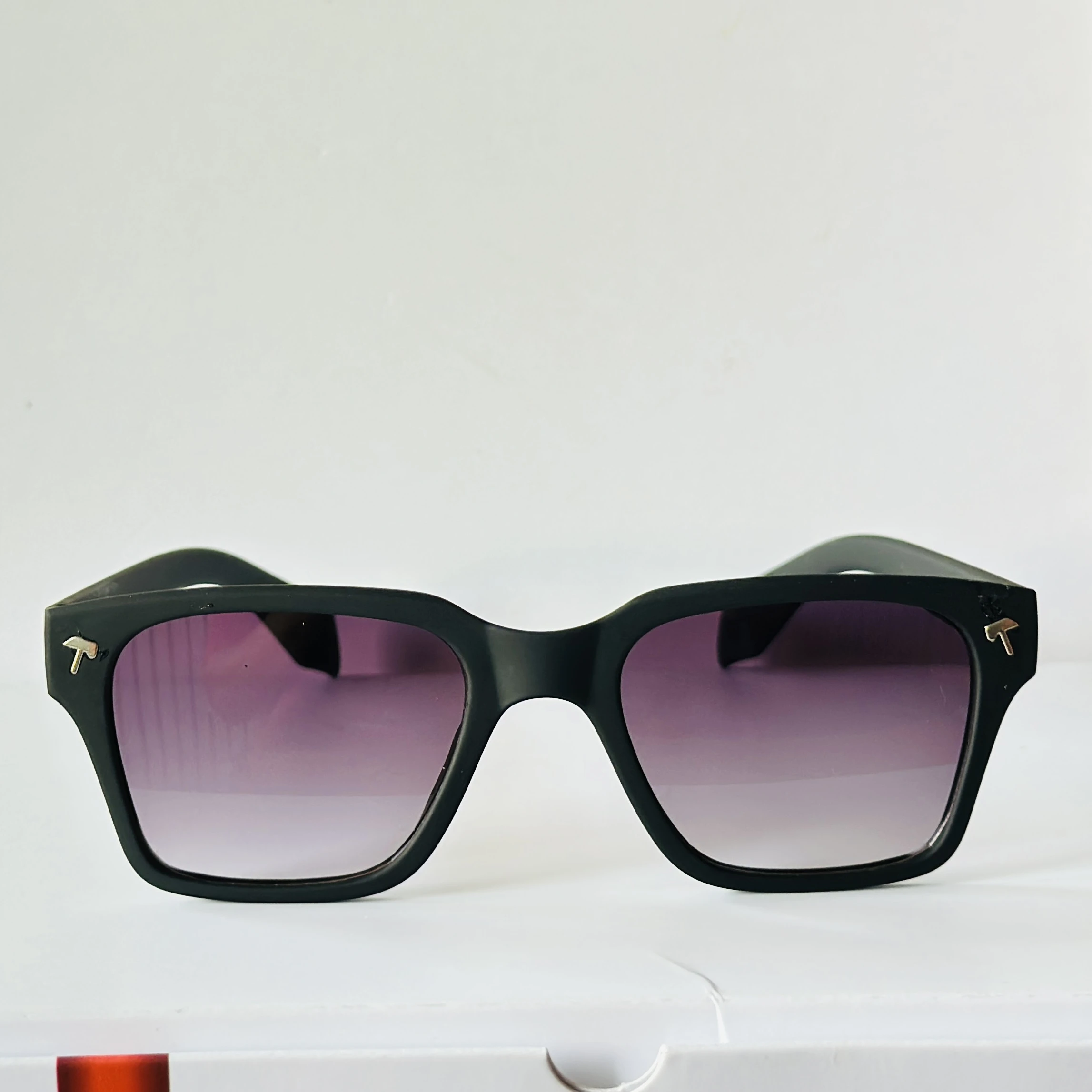 Black sunglasses appear to be the Tommy Hilfiger ML6012 model featuring gradient lenses