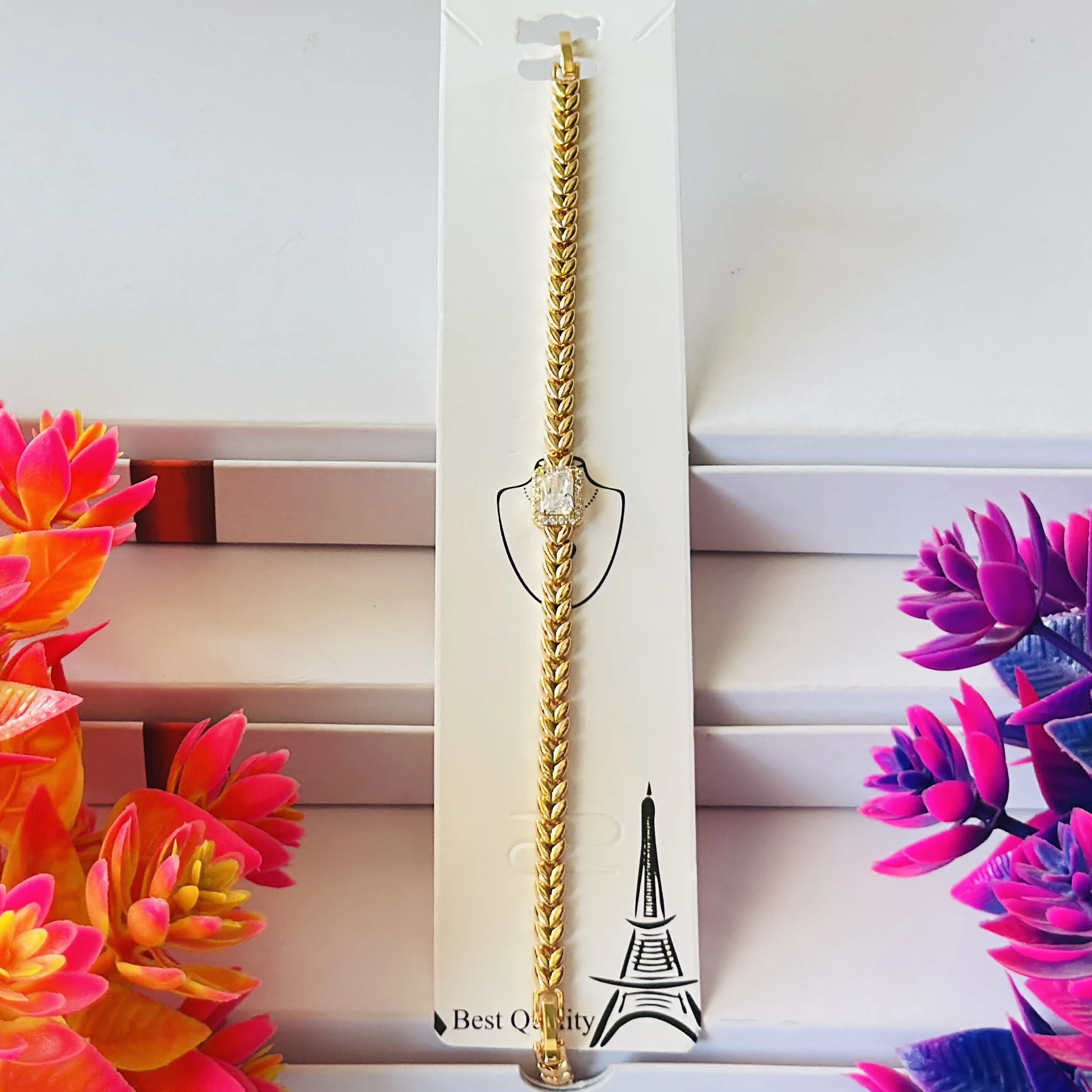Gold plated bracelet with a central cubic zirconia stone