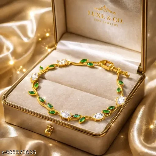 gold plated tulip bracelet featuring white oval crystals and green marquise leaf accents