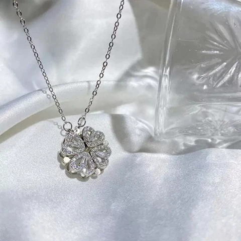 silver-toned, magnetic four-heart clover pendant necklace made of stainless steel
