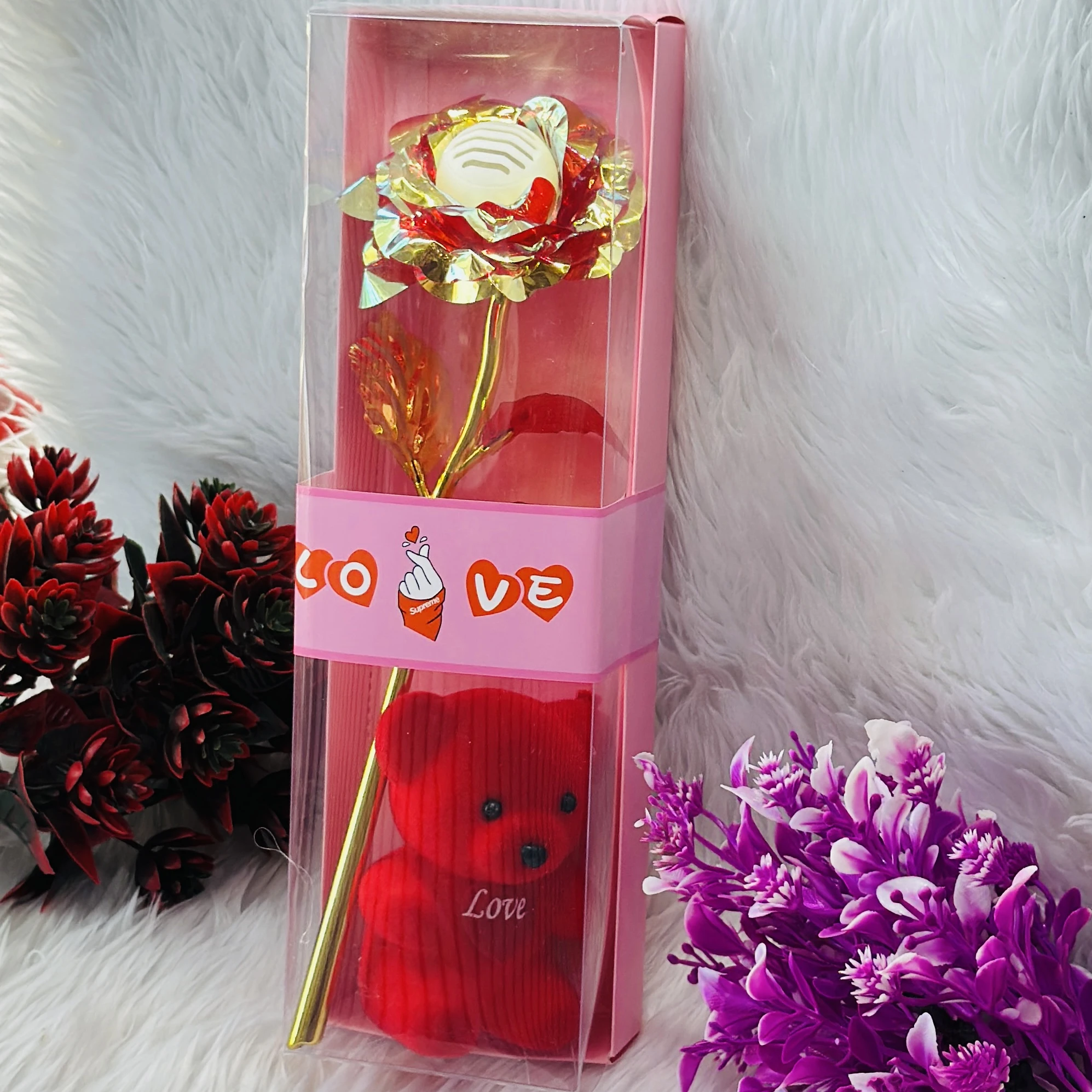 Gift set featuring an artificial golden rose and a red teddy bear, often marketed for Valentine's Day.