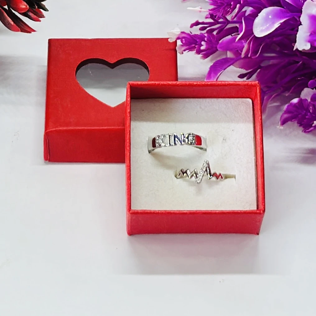set of silver-plated, stone-studded, adjustable couple rings.