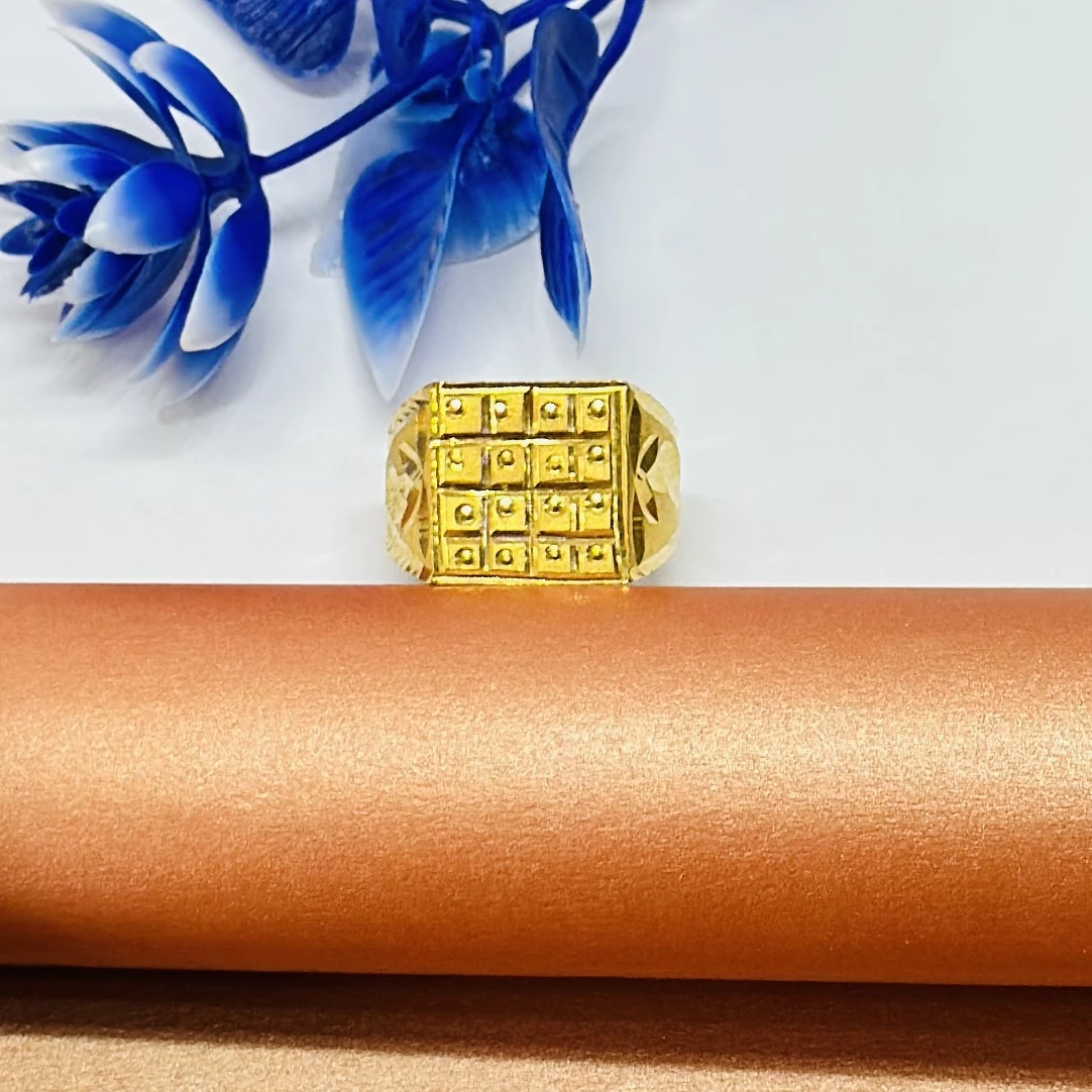 Men’s ring with a squared, grid-patterned top.