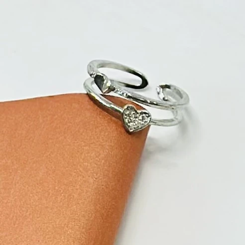 An adjustable sterling silver double heart ring