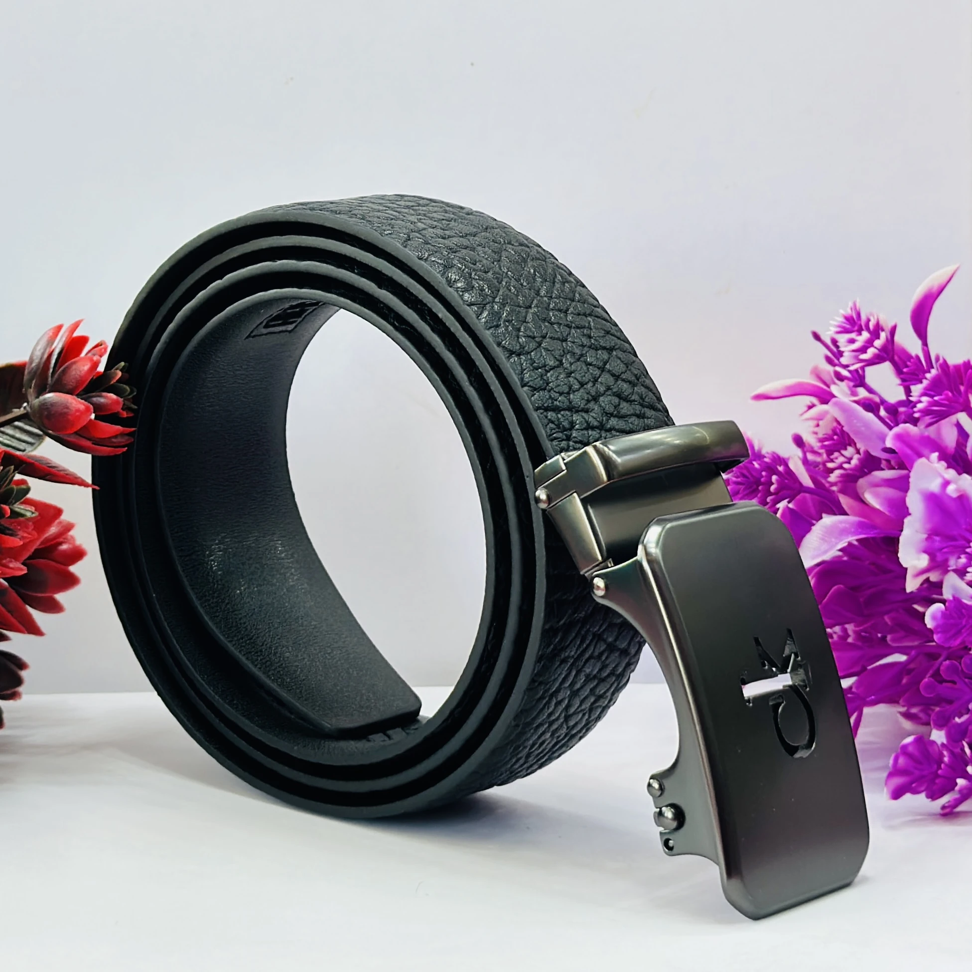 Calvin Klein black genuine leather men's belt with an automatic buckle.