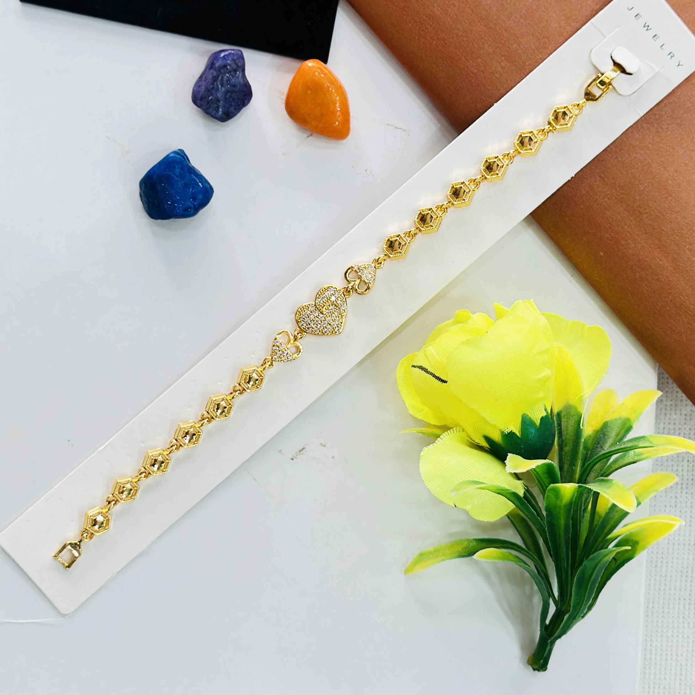 Gold plated bracelet with a central clover design