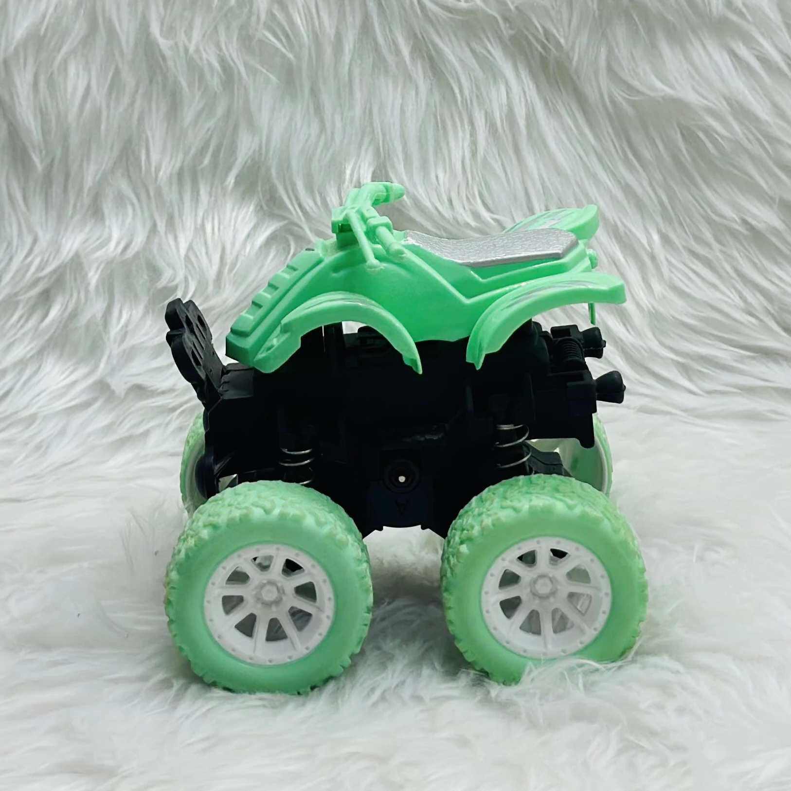 mini monster truck toy, which is typically a friction-powered stunt car.