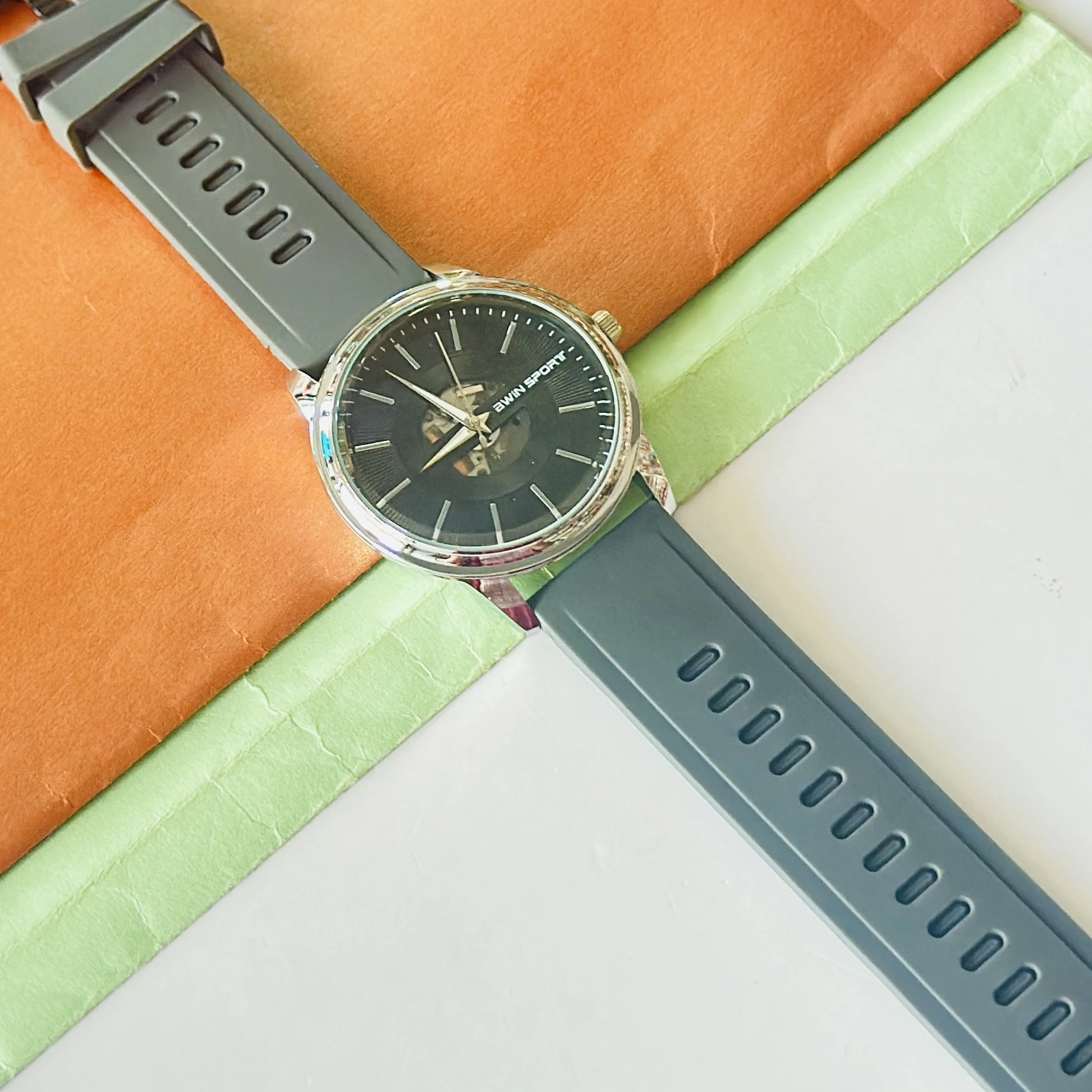 AWIN SPORT analog watch with a black dial and a grey silicone strap.