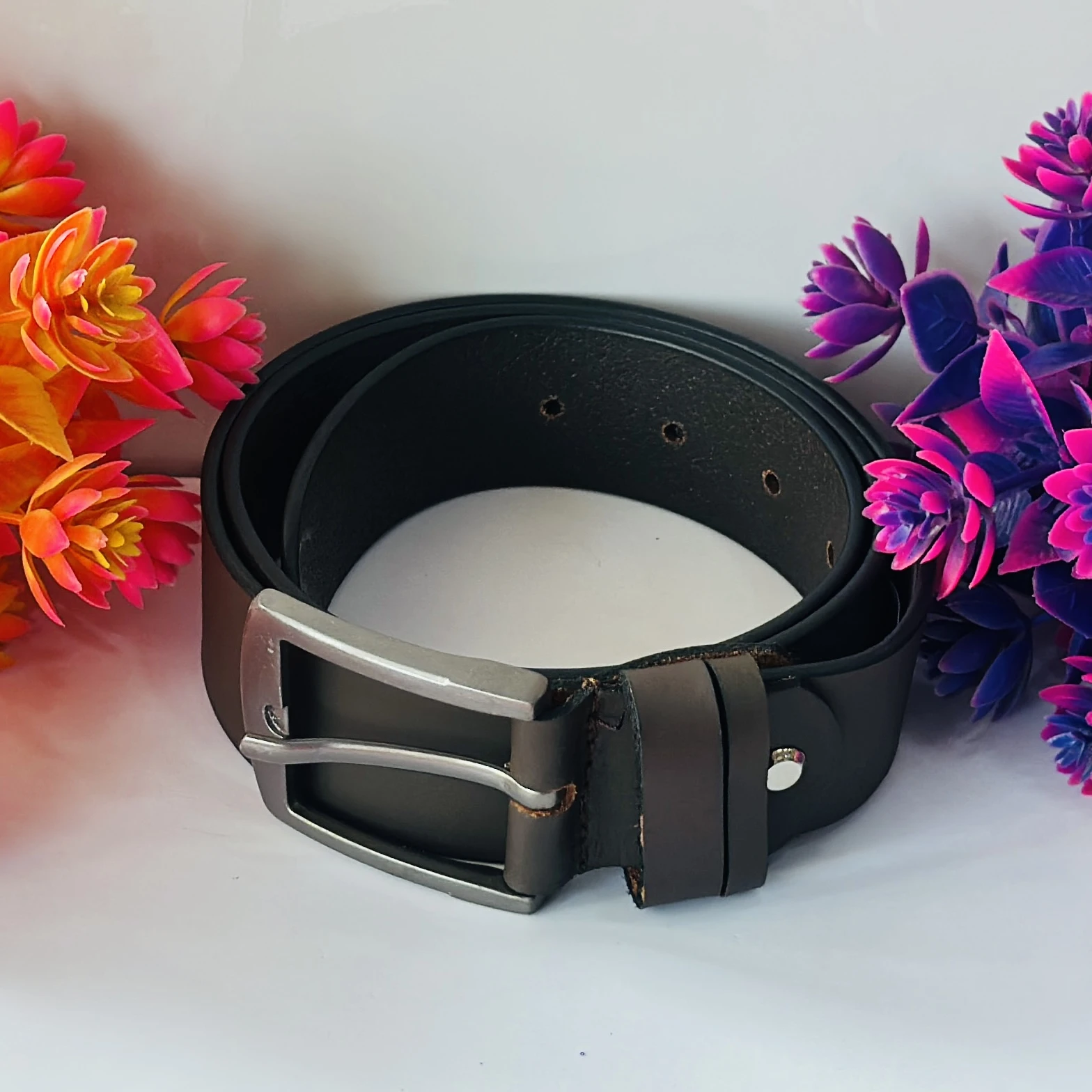 men's brown leather belt with a silver-tone buckle.