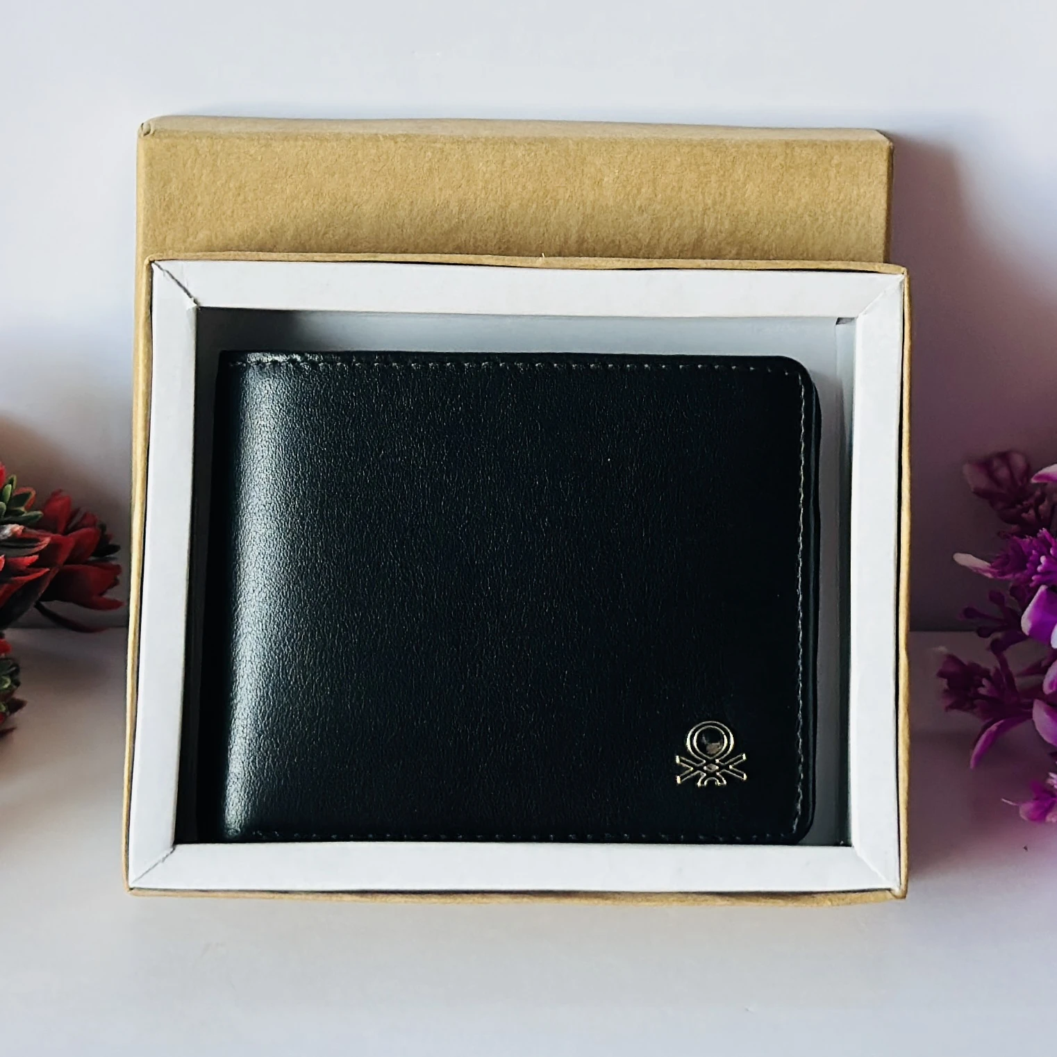 United Colors of Benetton black leather bi-fold wallet.