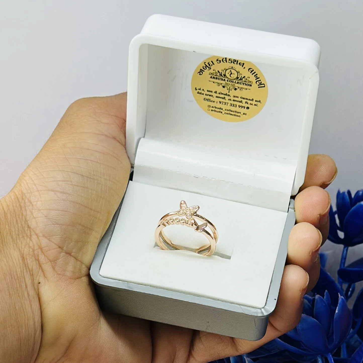 Rose gold plated cubic zirconia butterfly double band ring.