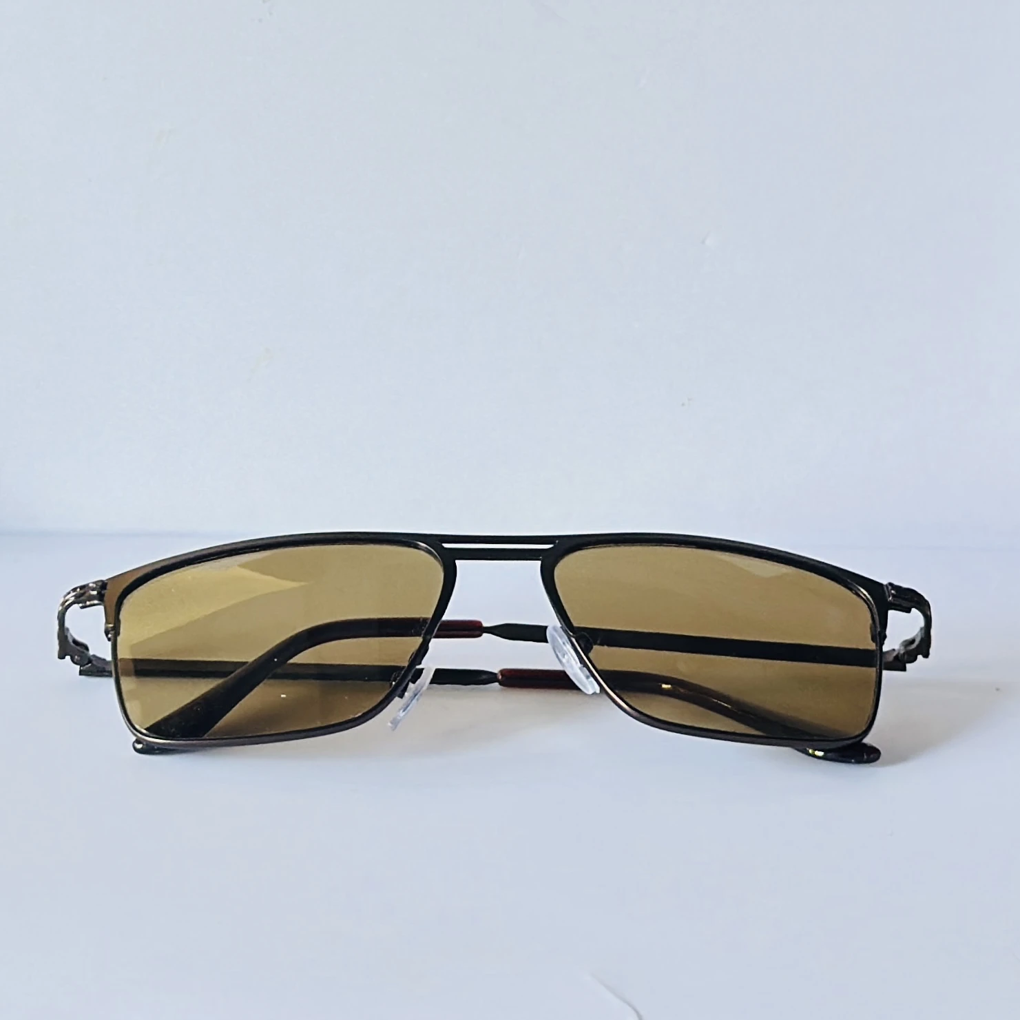 sunglasses appear to be the Vincent Chase