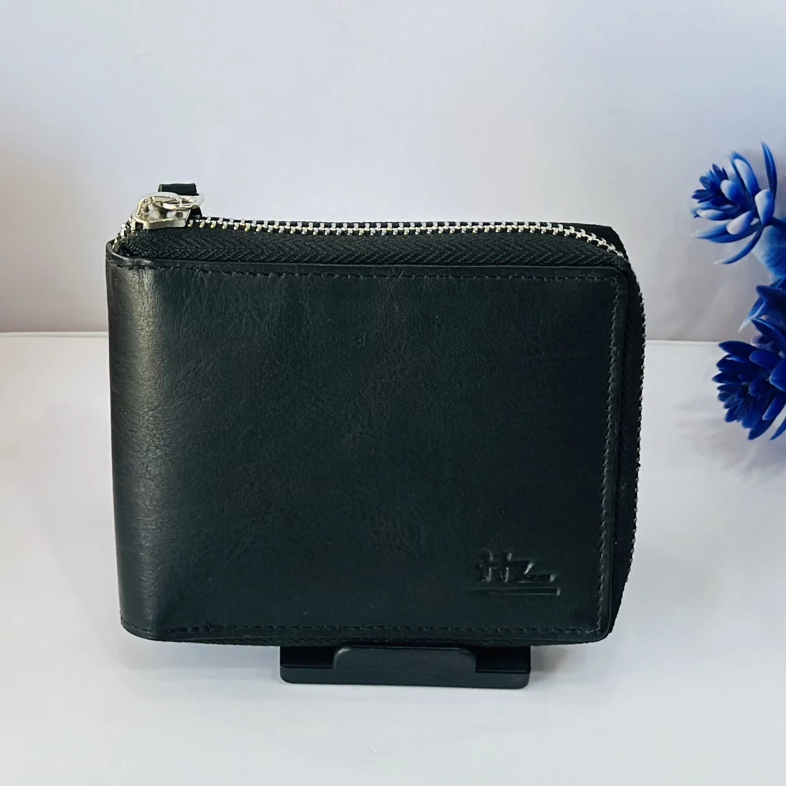 Black HZ leather zip-around wallet for men.