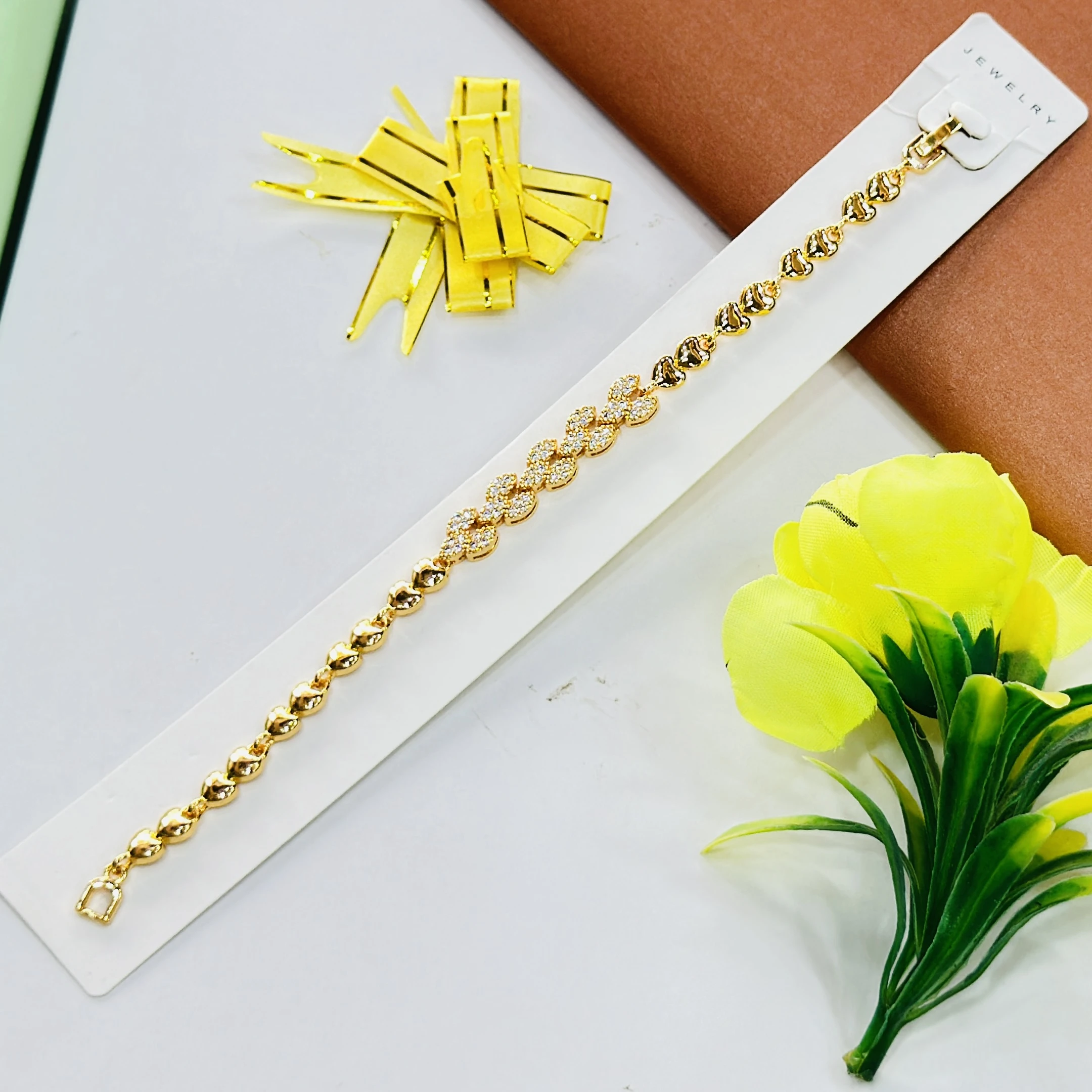 Gold plated bracelet with a heart and crystal design