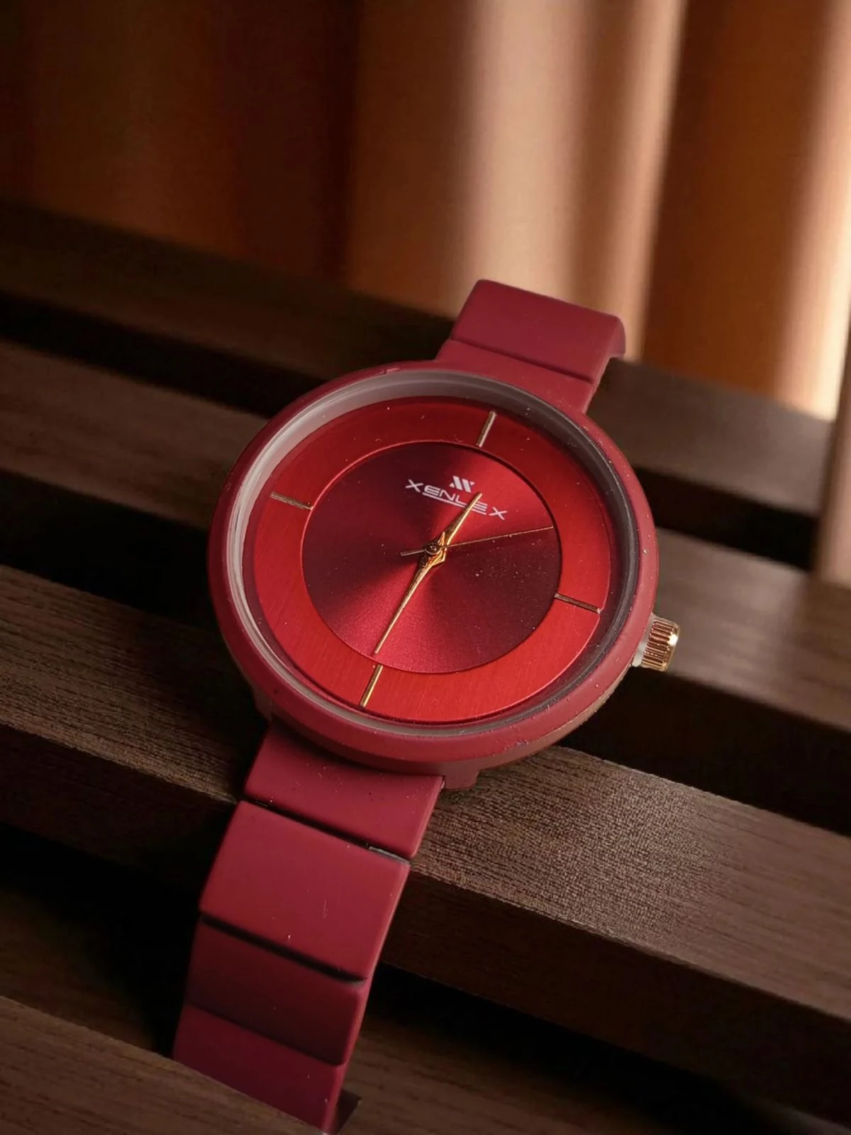 burgundy or red analogue watch for women, possibly from brands like Fastrack or Watchstar
