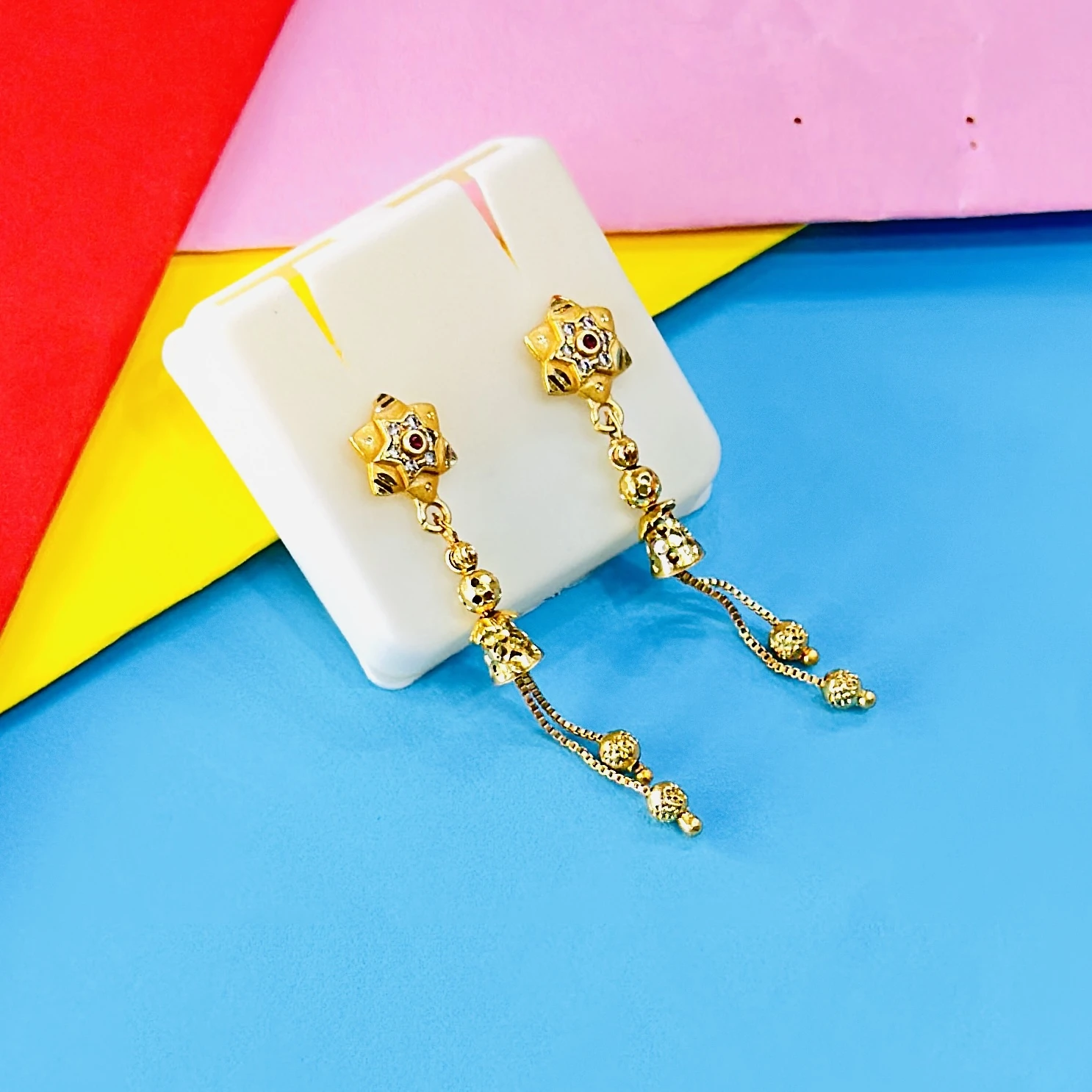 pair of intricate gold drop earrings