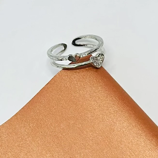 An adjustable sterling silver double heart ring