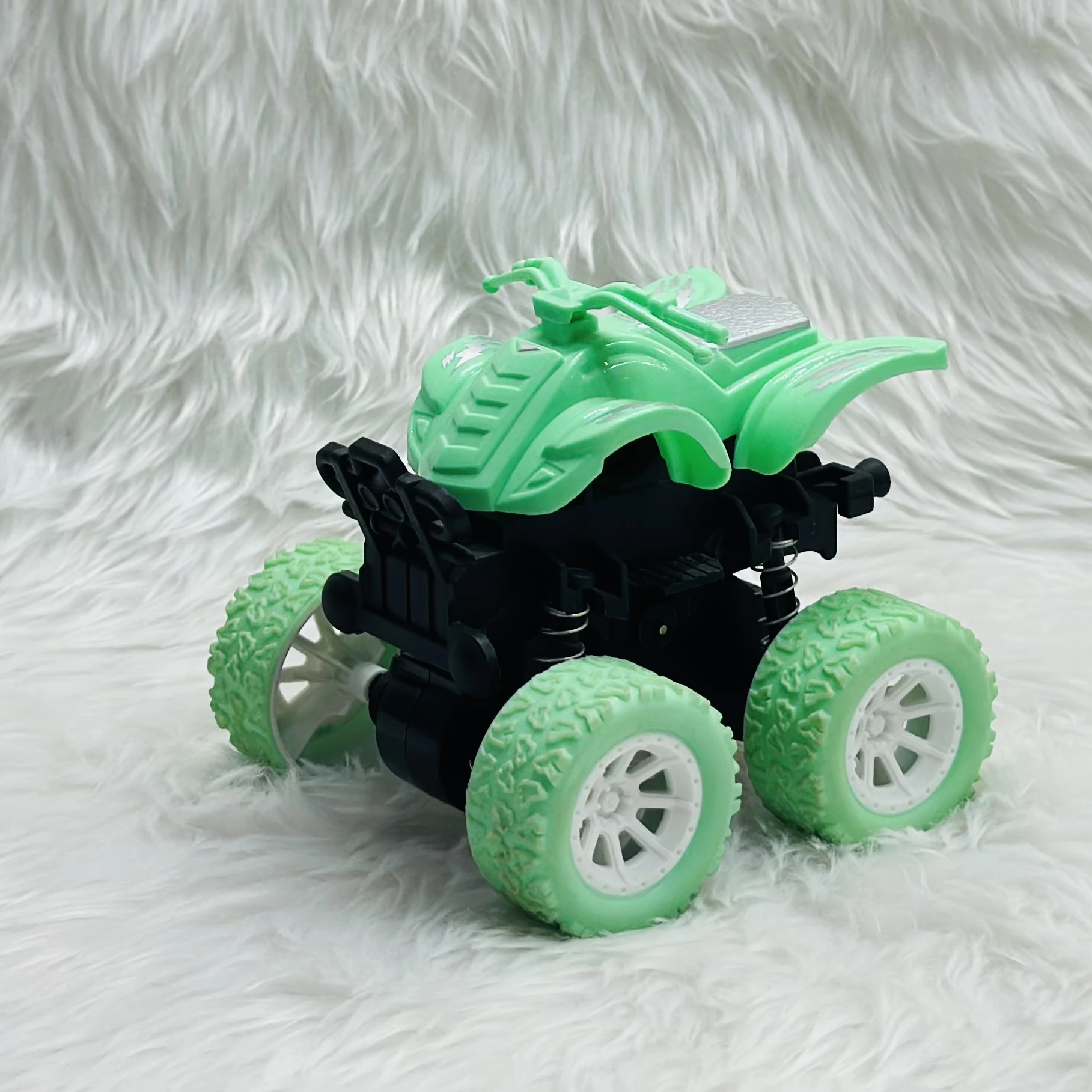 mini monster truck toy, which is typically a friction-powered stunt car.
