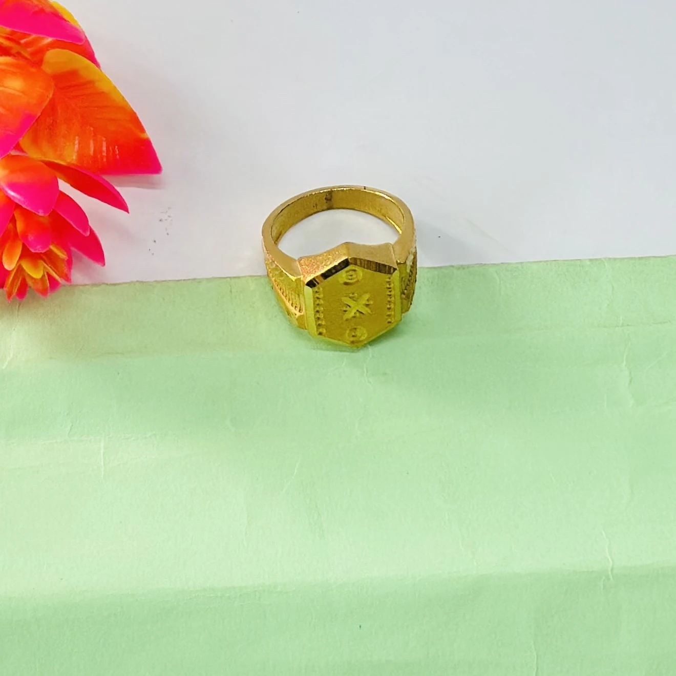 22kt yellow gold men's ring with a matte finish and machine-cut designs.