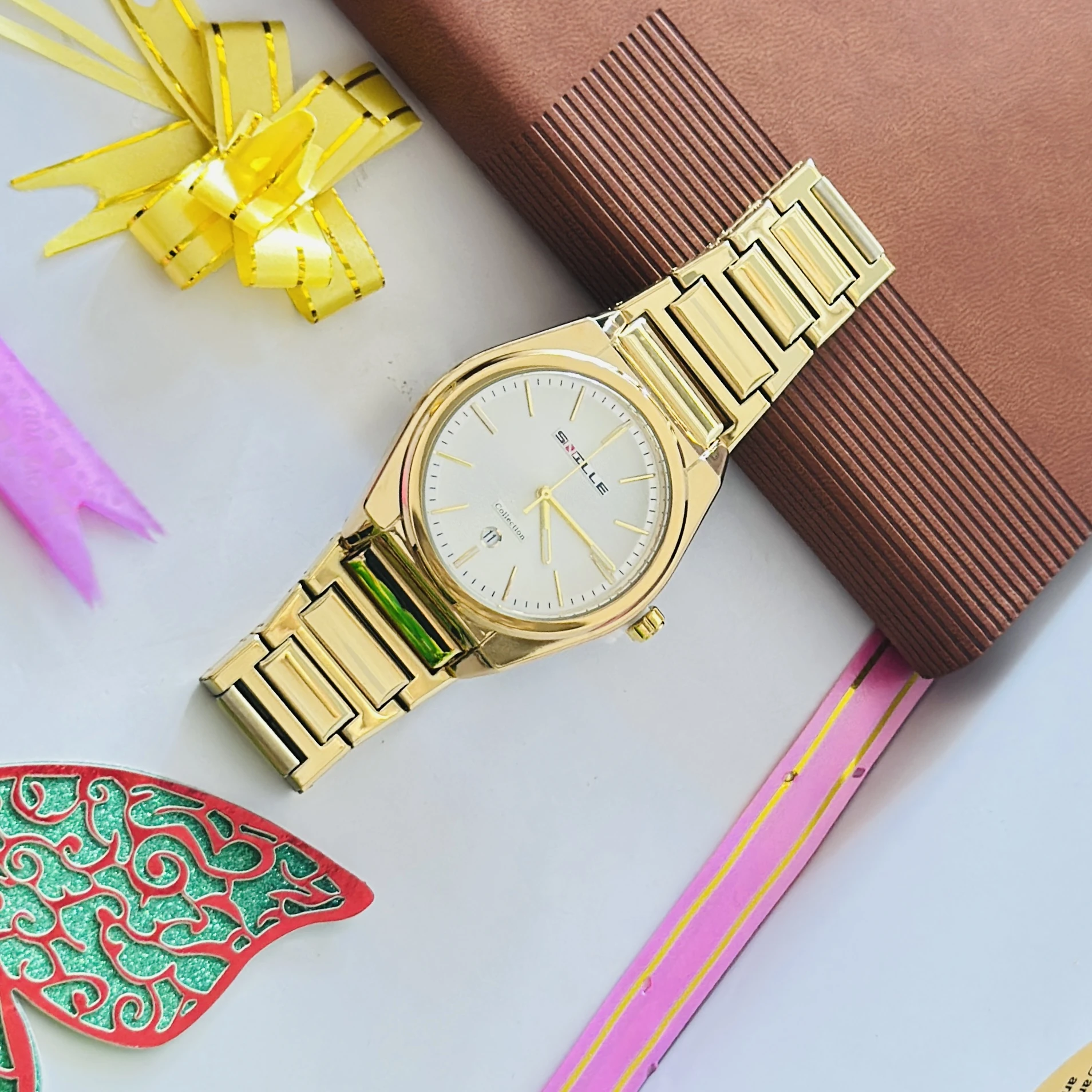 Gold colored metal strap watch
