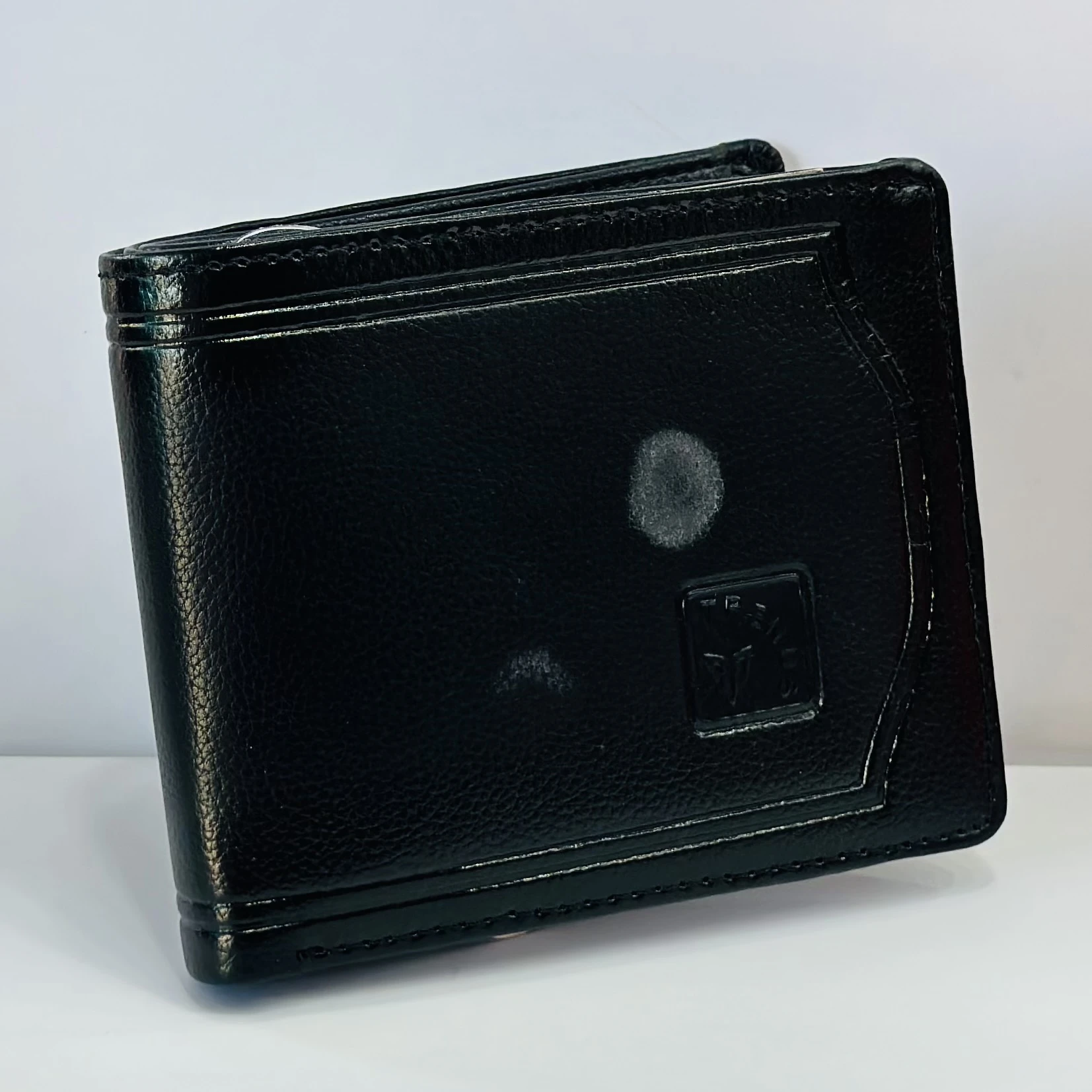 Black genuine leather bifold men's wallet from the brand Trends.