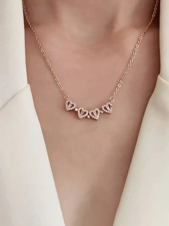 Rose gold-plated magnetic four-leaf clover heart pendant necklace.