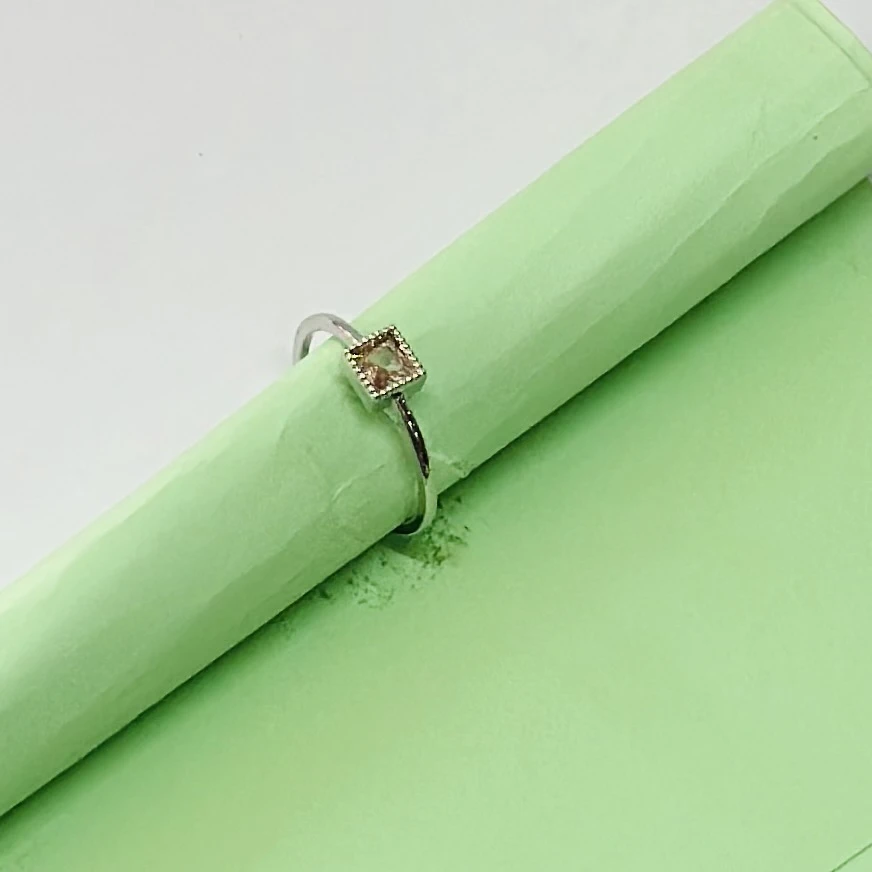 sterling silver ring with a square-cut smoky quartz or peridot gemstone.