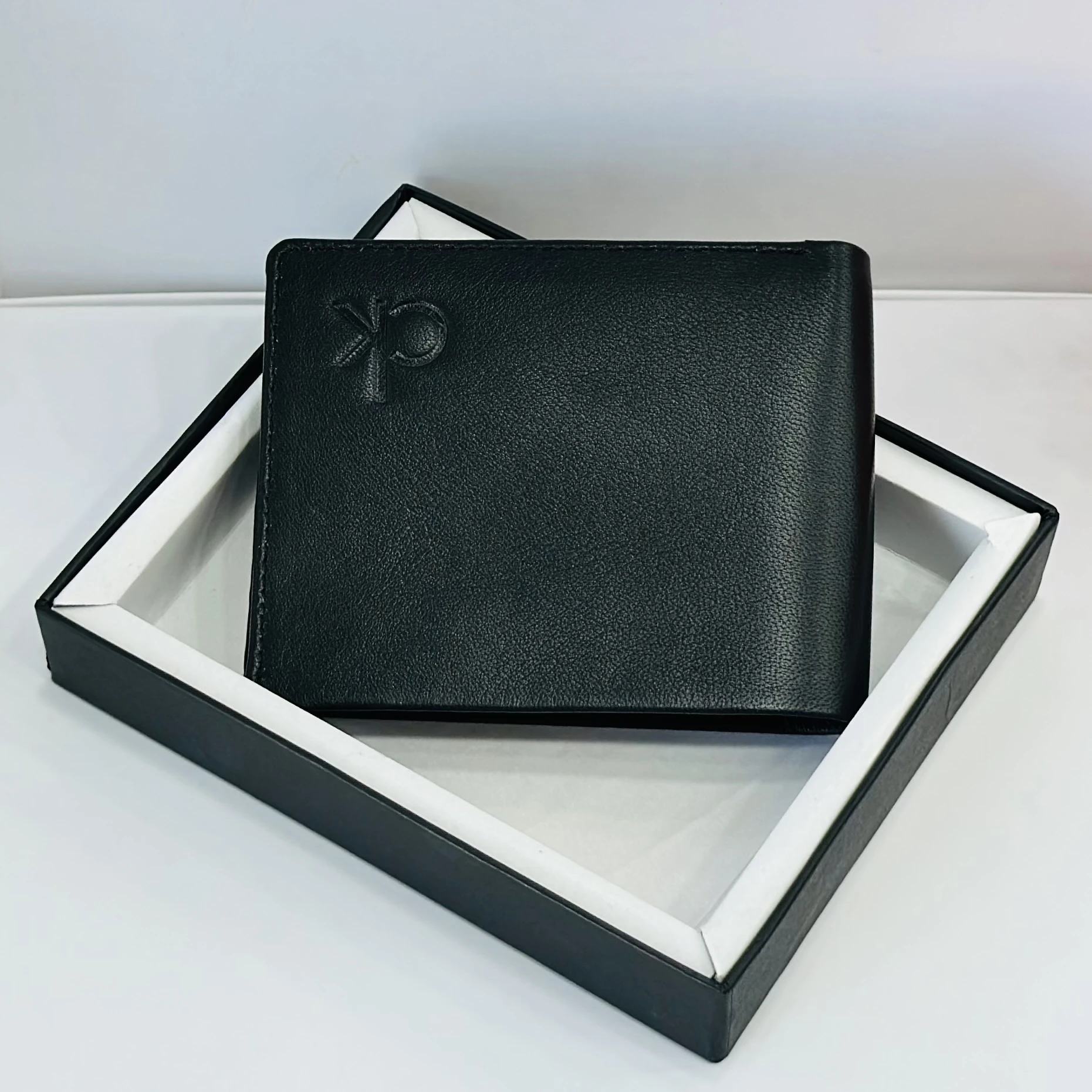 Calvin Klein men's black solid leather bi-fold wallet.