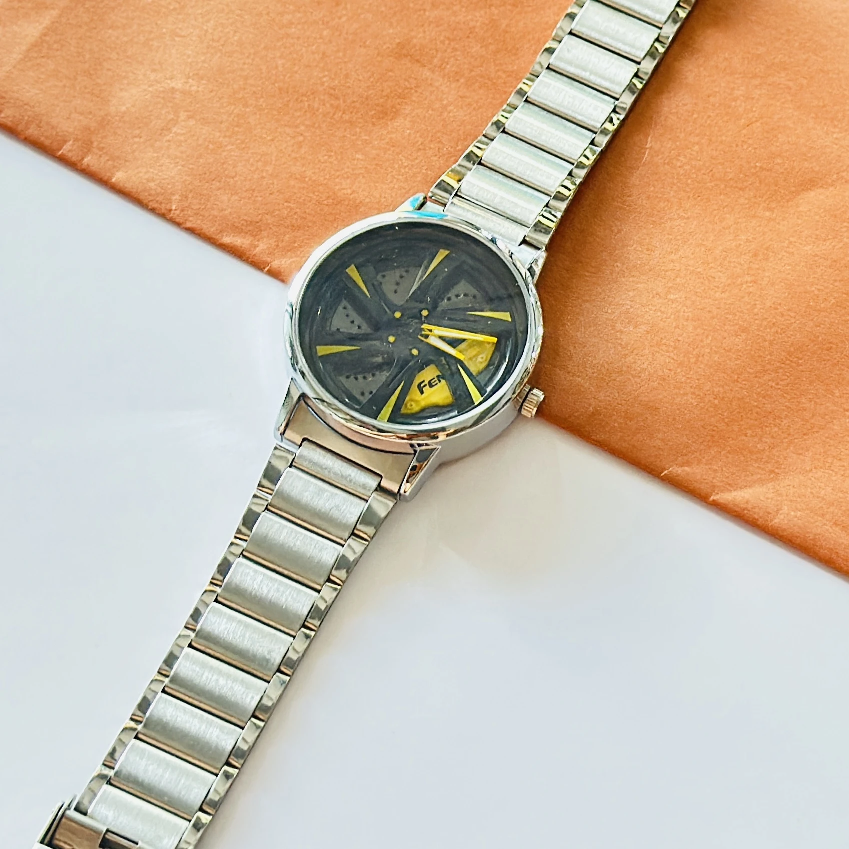 spinning car wheel rim-themed watch