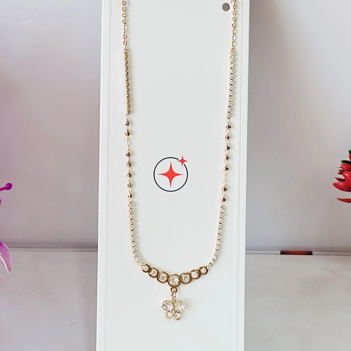 Rose gold-plated sterling silver chain with a flower pendant