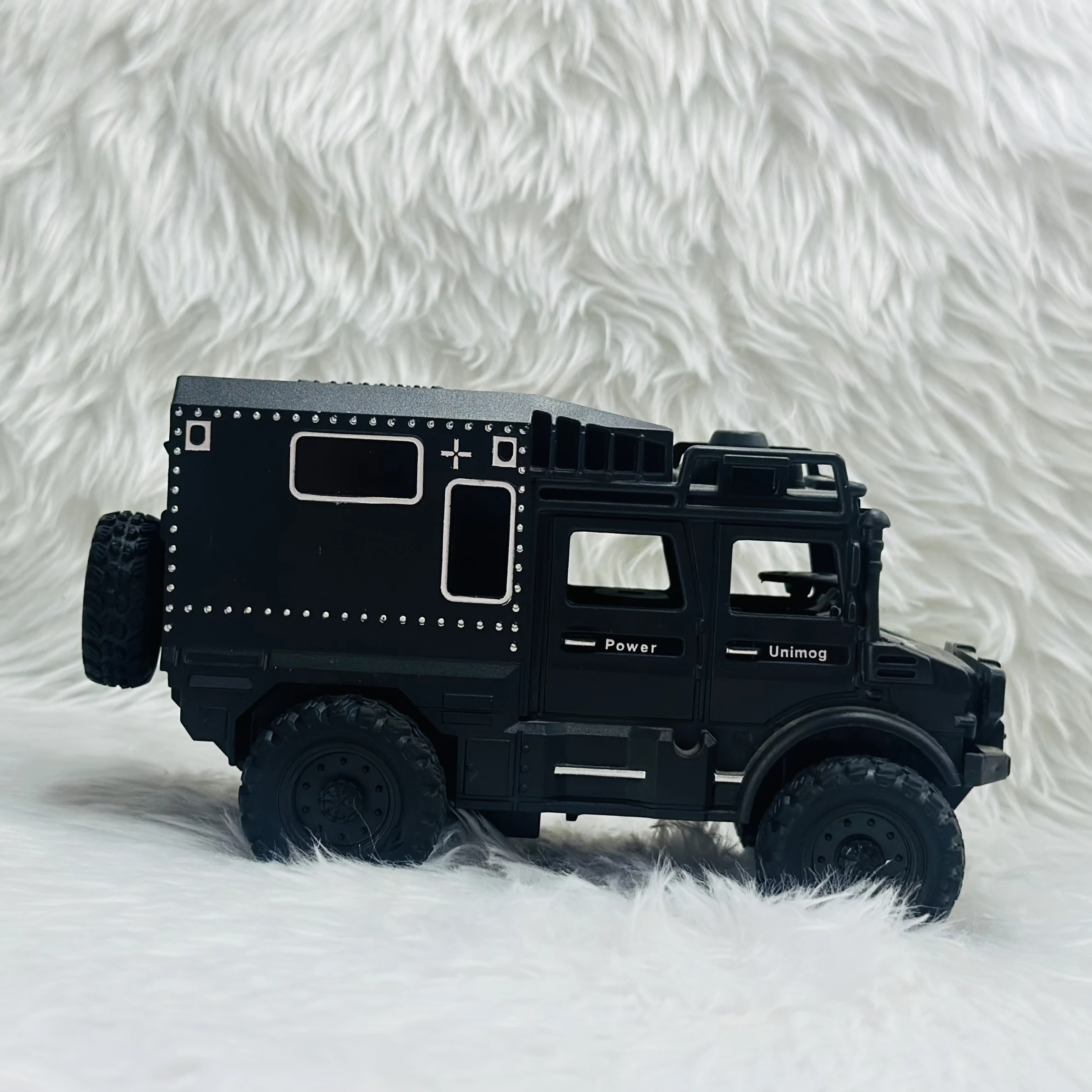 Toy Club Unimog army truck toy.