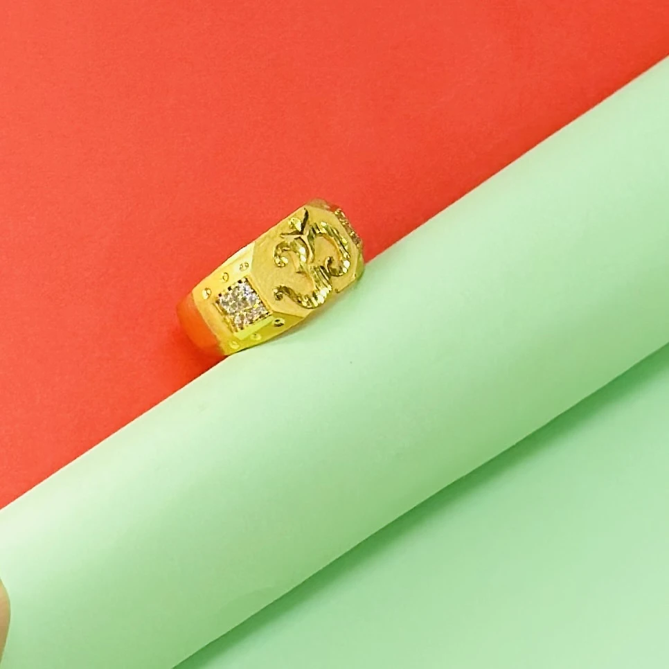 Gold plated men's ring featuring the "Om" symbol and small accent stones.