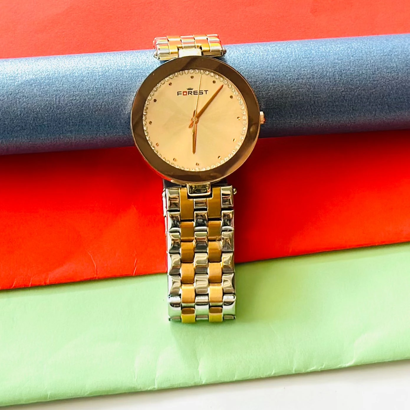 Forest women's watch with a round, gold-tone case