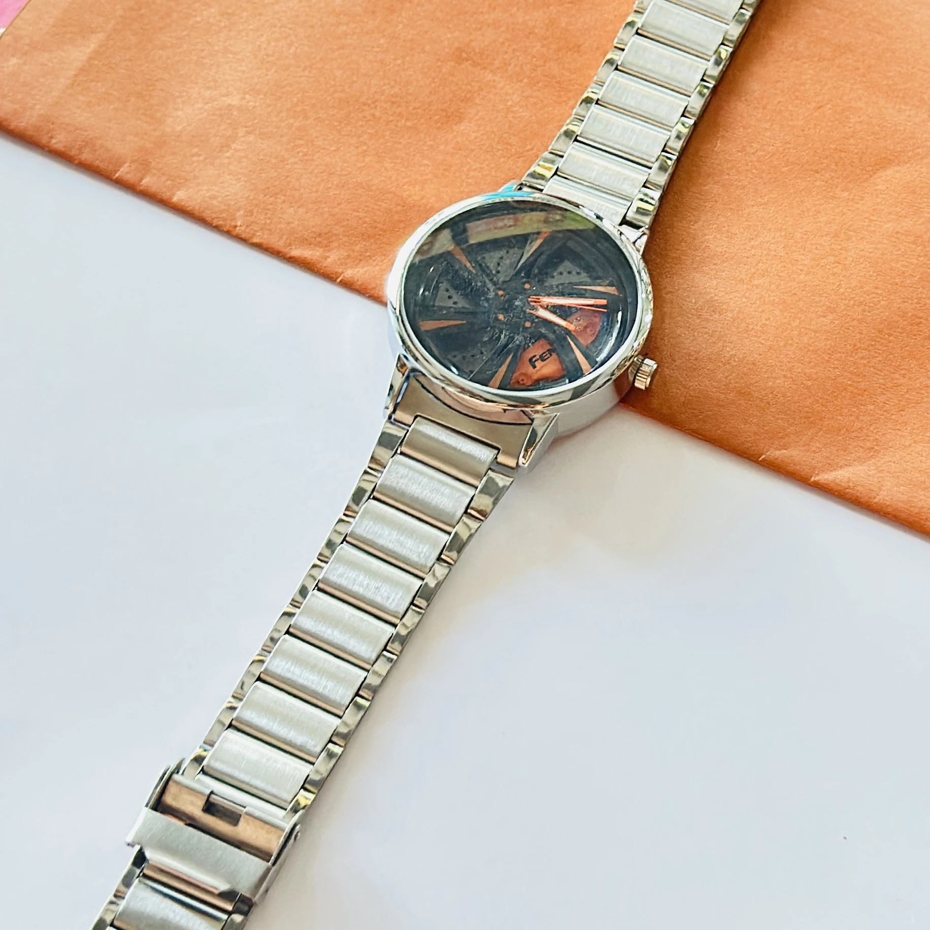 spinning car wheel rim-themed watch