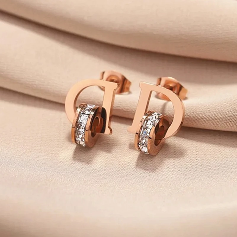 stainless steel CZ studded alphabetical letter "D" stud earrings.