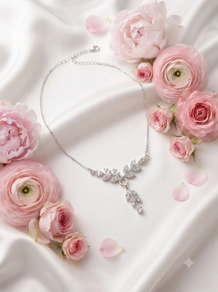 delicate necklace features leaf-shaped pendants
