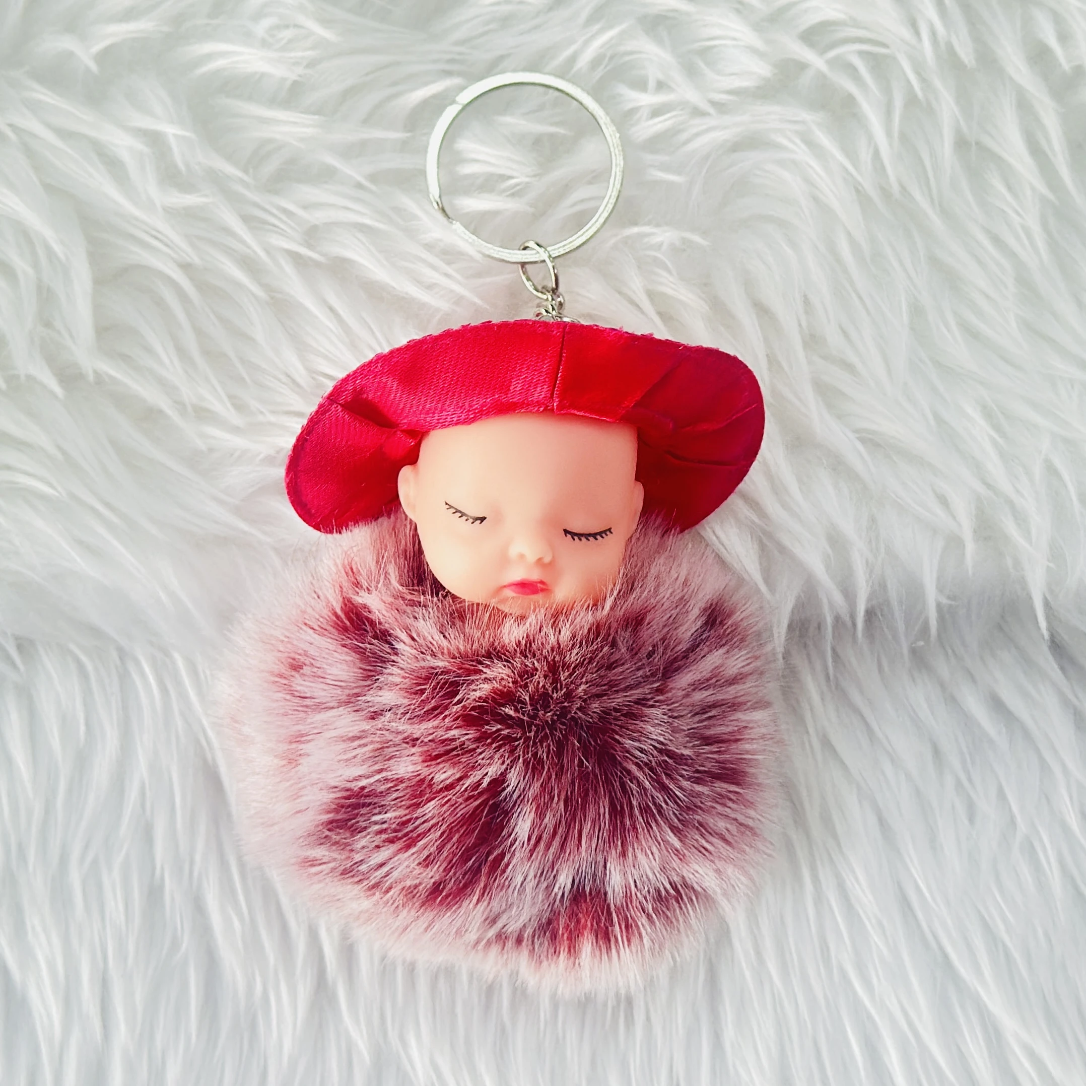 sleeping baby doll fluffy pom pom keychain