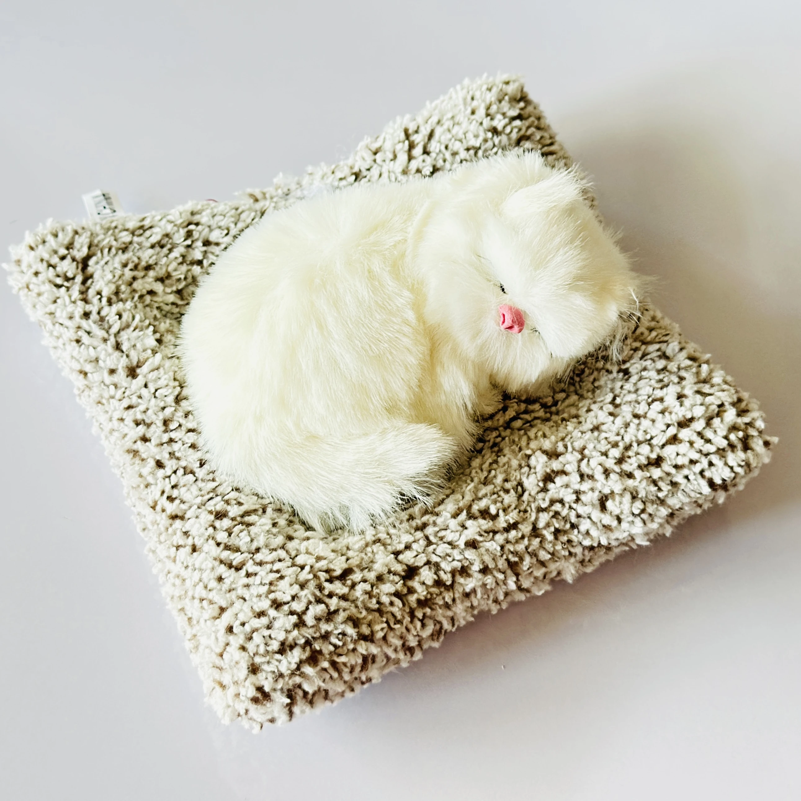 decorative sleeping cat figurine designed for car dashboards or home decor